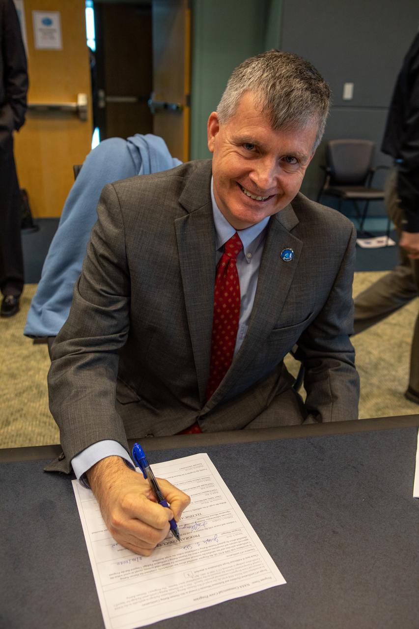 Steve Stich, manager of NASA’s Commercial Crew Program, signs the Human Rating Certification Plan for SpaceX’s crew transportation system, officially certifying the first commercial spacecraft system in history capable of transporting humans to and from the International Space Station as part of the agency’s Commercial Crew Program. The signing occurred during the Flight Readiness Review (FRR) for the NASA’s SpaceX Crew-1 mission at Kennedy Space Center in Florida on Nov. 10, 2020. The FRR focuses on the preparedness of SpaceX’s crew transportation system, the International Space Station, and its international partners to support the flight, and the certification of flight readiness. Crew-1 is the first regular crew mission of a U.S. commercial spacecraft with astronauts to the International Space Station as part of NASA’s Commercial Crew Program. The Crew Dragon Resilience capsule will launch atop a Falcon 9 rocket from Launch Complex 39A carrying NASA astronauts Michael Hopkins, Victor Glover, Shannon Walker and Japan Aerospace Exploration Agency (JAXA) astronaut Soichi Noguchi to the space station for a six-month science mission.