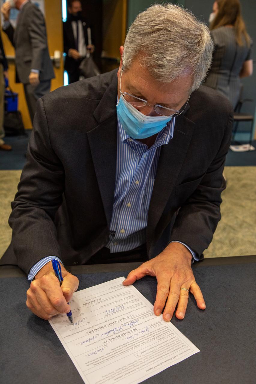 NASA Chief Engineer Ralph Roe signs the Human Rating Certification Plan for SpaceX’s crew transportation system, officially certifying the first commercial spacecraft system in history capable of transporting humans to and from the International Space Station as part of the agency’s Commercial Crew Program. The signing occurred during the Flight Readiness Review (FRR) for the NASA’s SpaceX Crew-1 mission at Kennedy Space Center in Florida on Nov. 10, 2020. The FRR focuses on the preparedness of SpaceX’s crew transportation system, the International Space Station, and its international partners to support the flight, and the certification of flight readiness. Crew-1 is the first regular crew mission of a U.S. commercial spacecraft with astronauts to the International Space Station as part of NASA’s Commercial Crew Program. The Crew Dragon Resilience capsule will launch atop a Falcon 9 rocket from Launch Complex 39A carrying NASA astronauts Michael Hopkins, Victor Glover, Shannon Walker and Japan Aerospace Exploration Agency (JAXA) astronaut Soichi Noguchi to the space station for a six-month science mission.