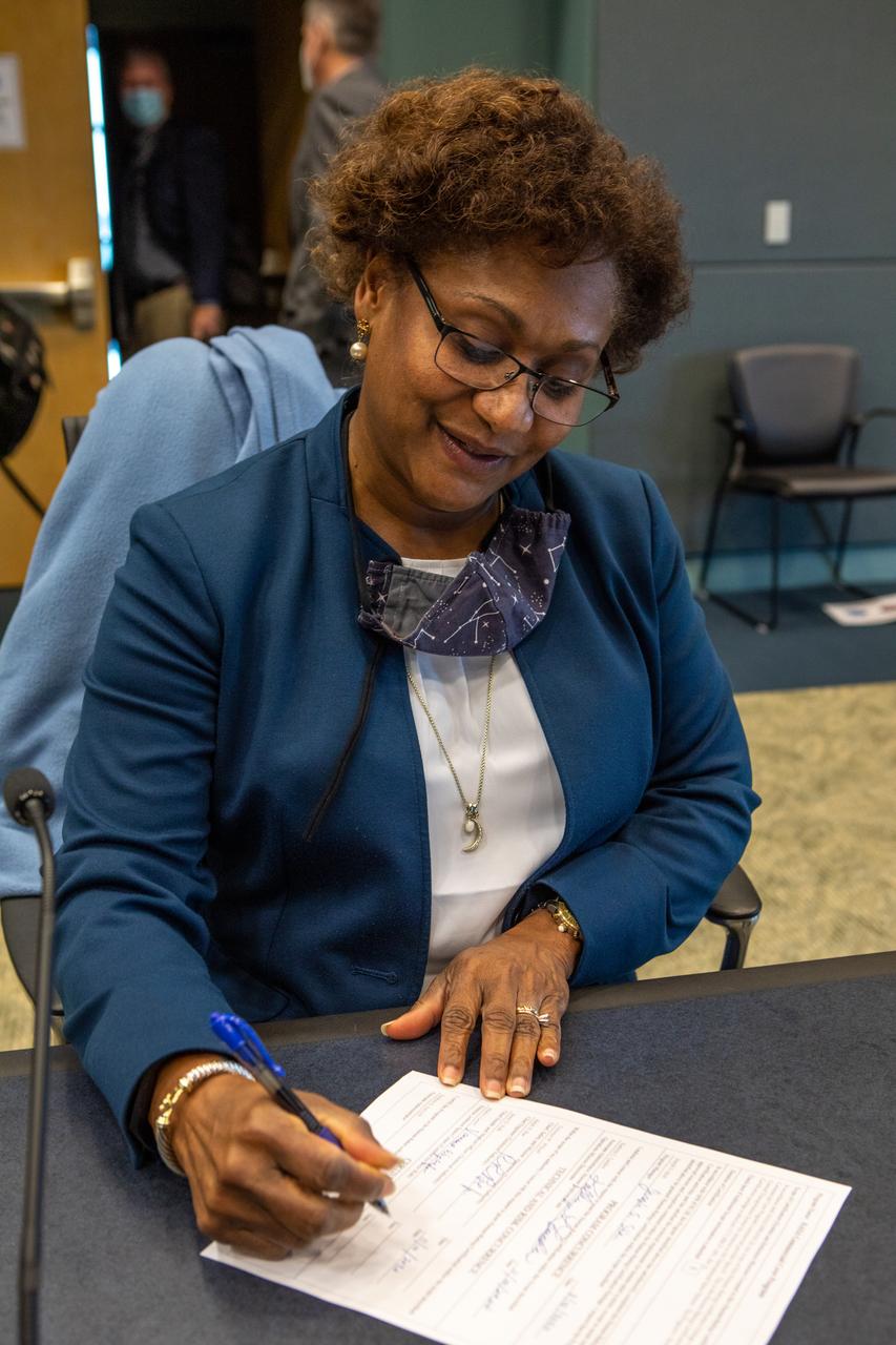 Johnson Space Center Deputy Director Vanessa Wyche signs the Human Rating Certification Plan for SpaceX’s crew transportation system, officially certifying the first commercial spacecraft system in history capable of transporting humans to and from the International Space Station as part of the agency’s Commercial Crew Program. The signing occurred during the Flight Readiness Review (FRR) for the NASA’s SpaceX Crew-1 mission at Kennedy Space Center in Florida on Nov. 10, 2020. The FRR focuses on the preparedness of SpaceX’s crew transportation system, the International Space Station, and its international partners to support the flight, and the certification of flight readiness. Crew-1 is the first regular crew mission of a U.S. commercial spacecraft with astronauts to the International Space Station as part of NASA’s Commercial Crew Program. The Crew Dragon Resilience capsule will launch atop a Falcon 9 rocket from Launch Complex 39A carrying NASA astronauts Michael Hopkins, Victor Glover, Shannon Walker and Japan Aerospace Exploration Agency (JAXA) astronaut Soichi Noguchi to the space station for a six-month science mission.