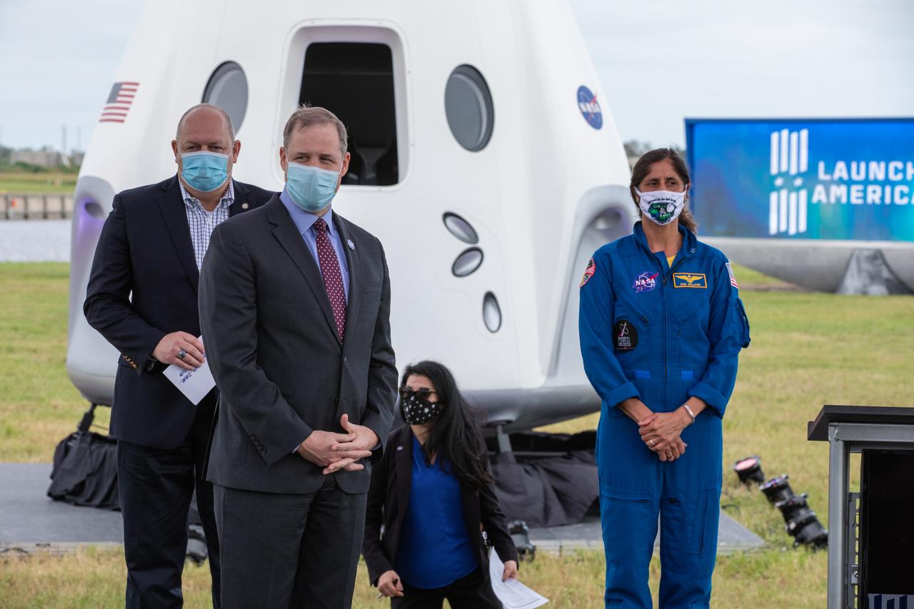 NASA Administrator Jim Bridenstine, center, prepares to speak during a press briefing Nov. 13, 2020, near the Press Site countdown clock at the agency’s Kennedy Space Center in Florida. Behind him, from left are Steve Dickson, administrator, Federal Aviation Administration, and NASA astronaut Sunita Williams. Crew-1 is the first regular crew mission of a U.S. commercial spacecraft with astronauts to the International Space Station as part of NASA’s Commercial Crew Program. The SpaceX Crew Dragon Resilience capsule will launch atop the company’s Falcon 9 rocket from Launch Complex 39A to the space station for a six-month science mission.