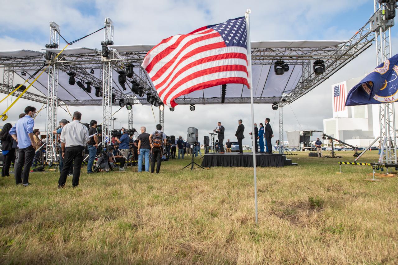 Members of the news media attend a press briefing Nov. 13, 2020, near the Press Site countdown clock at NASA’s Kennedy Space Center in Florida ahead of the agency’s SpaceX Crew-1 launch. Participating in the briefing, on the raised platform, are NASA Administrator Jim Bridenstine; Steve Dickson, administrator, Federal Aviation Administration; Kennedy Center Director Bob Cabana; Hiroshi Sasaki, vice president and director general, JAXA’s Human Spaceflight Technology Directorate; NASA astronaut Jonny Kim; and NASA astronaut Sunita Williams. Crew-1 is the first regular crew mission of a U.S. commercial spacecraft with astronauts to the International Space Station as part of NASA’s Commercial Crew Program. The SpaceX Crew Dragon Resilience capsule will launch atop the company’s Falcon 9 rocket from Launch Complex 39A to the space station for a six-month science mission.