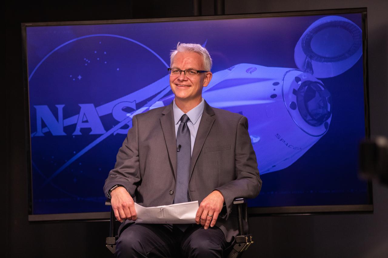 Benji Reed, senior director, Human Spaceflight Programs, SpaceX, answers questions during a virtual prelaunch news conference Nov. 13, 2020, inside the Press Site auditorium at NASA’s Kennedy Space Center in Florida ahead of the agency’s SpaceX Crew-1 launch. Crew-1 is the first regular crew mission of a U.S. commercial spacecraft with astronauts to the International Space Station as part of NASA’s Commercial Crew Program. The SpaceX Crew Dragon Resilience capsule will launch atop the company’s Falcon 9 rocket from Launch Complex 39A to the space station for a six-month science mission.