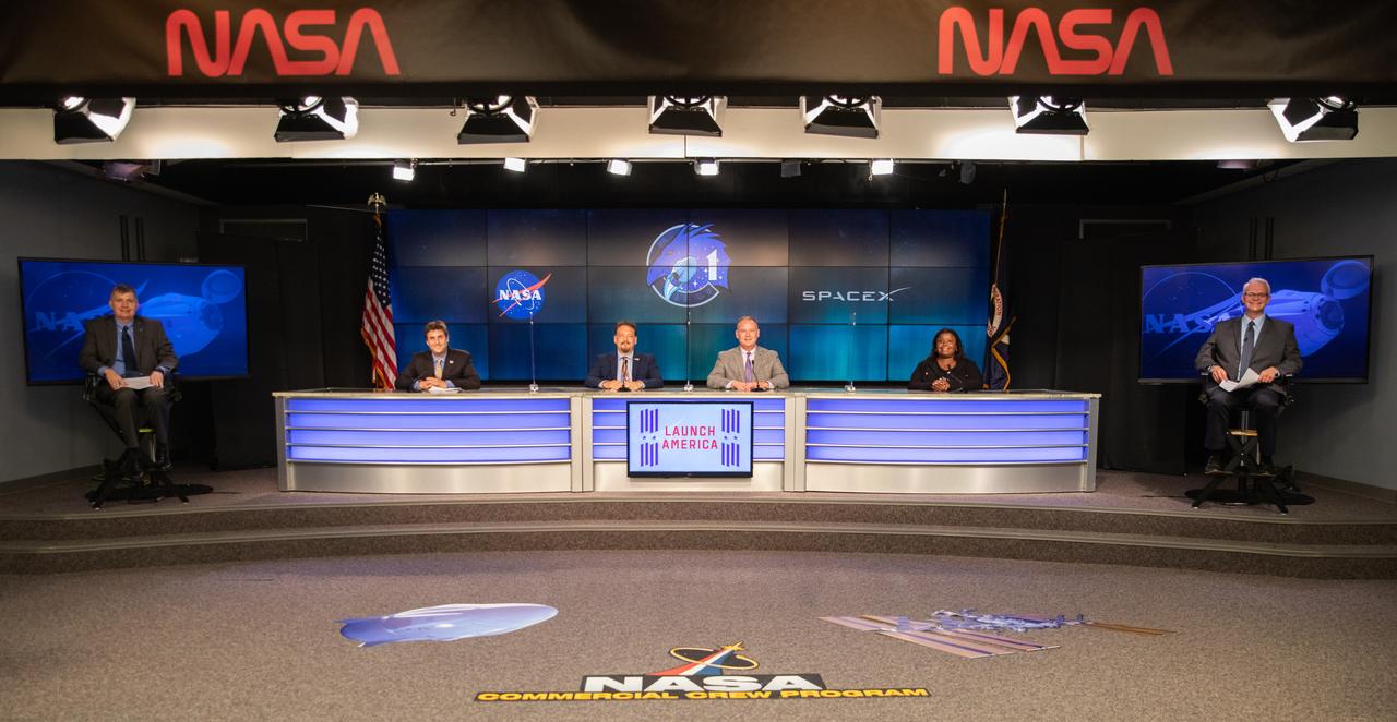 Inside the Press Site auditorium at NASA’s Kennedy Space Center in Florida, NASA and industry leaders conduct a virtual prelaunch news conference Nov. 13, 2020, ahead of the agency’s SpaceX Crew-1 mission. From left are Steve Stich, manager, Commercial Crew Program, Kennedy Space Center; Joel Montalbano, manager, International Space Station, Johnson Space Center; Kirt Costello, chief scientist, International Space Station Program, Johnson; Norm Knight, deputy manager, Flight Operations Directorate, Johnson; Arlena Moses, launch weather officer, U.S. Air Force 45th Weather Squadron; and Benji Reed, senior director, Human Spaceflight Programs, SpaceX. Crew-1 is the first regular crew mission of a U.S. commercial spacecraft with astronauts to the International Space Station as part of NASA’s Commercial Crew Program. The SpaceX Crew Dragon Resilience capsule will launch atop the company’s Falcon 9 rocket from Launch Complex 39A to the space station for a six-month science mission.
