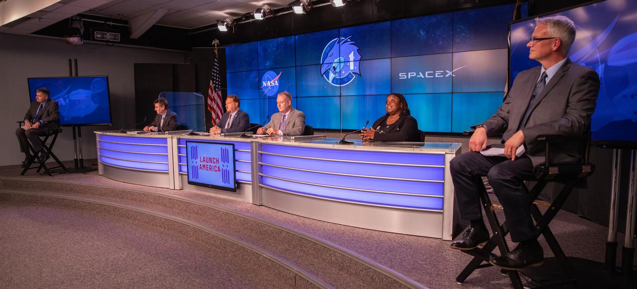 Inside the Press Site auditorium at NASA’s Kennedy Space Center in Florida, NASA and industry leaders conduct a virtual prelaunch news conference Nov. 13, 2020, ahead of the agency’s SpaceX Crew-1 mission. From left are Steve Stich, manager, Commercial Crew Program, Kennedy Space Center; Joel Montalbano, manager, International Space Station, Johnson Space Center; Kirt Costello, chief scientist, International Space Station Program, Johnson; Norm Knight, deputy manager, Flight Operations Directorate, Johnson; Arlena Moses, launch weather officer, U.S. Air Force 45th Weather Squadron; and Benji Reed, senior director, Human Spaceflight Programs, SpaceX. Crew-1 is the first regular crew mission of a U.S. commercial spacecraft with astronauts to the International Space Station as part of NASA’s Commercial Crew Program. The SpaceX Crew Dragon Resilience capsule will launch atop the company’s Falcon 9 rocket from Launch Complex 39A to the space station for a six-month science mission.