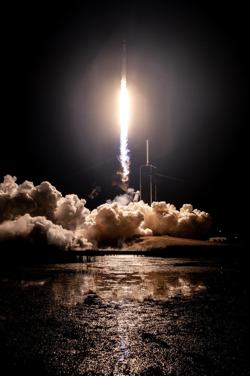 A SpaceX Falcon 9 rocket lifts off at 7:27 p.m. EST from Launch Complex 39A at NASA’s Kennedy Space Center in Florida on Nov. 15, 2020, carrying the company’s Crew Dragon Resilience capsule. Onboard the capsule are NASA’s SpaceX Crew-1 NASA astronauts, Michael Hopkins, spacecraft commander; Victor Glover, pilot; Shannon Walker, mission specialist; and Japan Aerospace Exploration Agency astronaut Soichi Noguchi, mission specialist. Crew-1 is the first regular crew mission of a U.S. commercial spacecraft with astronauts to the International Space Station as part of NASA’s Commercial Crew Program. The Crew Dragon will dock with the space station and the crew will remain on the orbiting laboratory for a six-month science mission. 