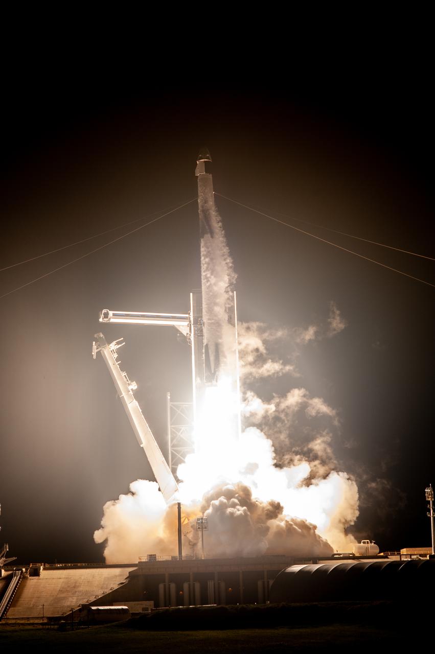 A SpaceX Falcon 9 rocket lifts off at 7:27 p.m. EST from Launch Complex 39A at NASA’s Kennedy Space Center in Florida on Nov. 15, 2020, carrying the company’s Crew Dragon Resilience capsule. Onboard the capsule are NASA’s SpaceX Crew-1 NASA astronauts, Michael Hopkins, spacecraft commander; Victor Glover, pilot; Shannon Walker, mission specialist; and Japan Aerospace Exploration Agency astronaut Soichi Noguchi, mission specialist. Crew-1 is the first regular crew mission of a U.S. commercial spacecraft with astronauts to the International Space Station as part of NASA’s Commercial Crew Program. The Crew Dragon will dock with the space station and the crew will remain on the orbiting laboratory for a six-month science mission.