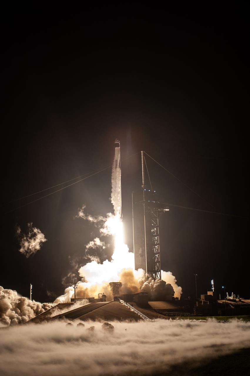 A SpaceX Falcon 9 rocket lifts off at 7:27 p.m. EST from Launch Complex 39A at NASA’s Kennedy Space Center in Florida on Nov. 15, 2020, carrying the company’s Crew Dragon Resilience capsule. Onboard the capsule are NASA’s SpaceX Crew-1 NASA astronauts, Michael Hopkins, spacecraft commander; Victor Glover, pilot; Shannon Walker, mission specialist; and Japan Aerospace Exploration Agency astronaut Soichi Noguchi, mission specialist. Crew-1 is the first regular crew mission of a U.S. commercial spacecraft with astronauts to the International Space Station as part of NASA’s Commercial Crew Program. The Crew Dragon will dock with the space station and the crew will remain on the orbiting laboratory for a six-month science mission.