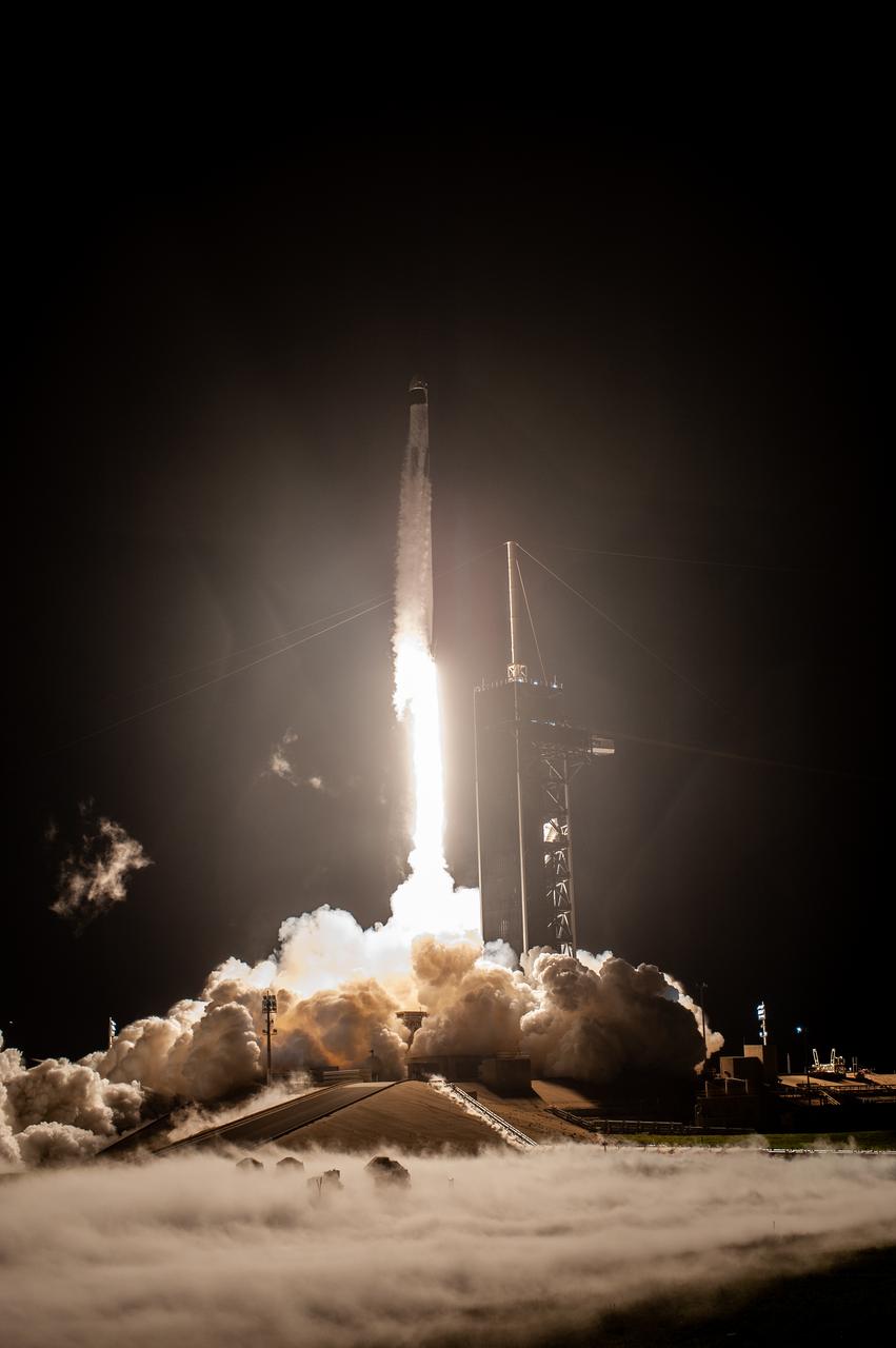 A SpaceX Falcon 9 rocket lifts off at 7:27 p.m. EST from Launch Complex 39A at NASA’s Kennedy Space Center in Florida on Nov. 15, 2020, carrying the company’s Crew Dragon Resilience capsule. Onboard the capsule are NASA’s SpaceX Crew-1 NASA astronauts, Michael Hopkins, spacecraft commander; Victor Glover, pilot; Shannon Walker, mission specialist; and Japan Aerospace Exploration Agency astronaut Soichi Noguchi, mission specialist. Crew-1 is the first regular crew mission of a U.S. commercial spacecraft with astronauts to the International Space Station as part of NASA’s Commercial Crew Program. The Crew Dragon will dock with the space station and the crew will remain on the orbiting laboratory for a six-month science mission.