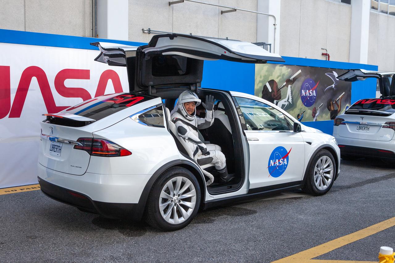 NASA SpaceX’s Crew-1 astronauts board two Tesla vehicles for the trip to Launch Complex 39A after emerging from the Neil Armstrong Operations and Checkout Building at NASA’s Kennedy Space Center in Florida on Nov. 15, 2020. NASA astronauts Michael Hopkins, spacecraft commander; Victor Glover, pilot; and Shannon Walker, mission specialist; and JAXA astronaut Soichi Noguchi, mission specialist will board the Crew Dragon for the first regular crew mission of a U.S. commercial spacecraft with astronauts to the International Space Station as part of NASA’s Commercial Crew Program. The SpaceX Crew Dragon Resilience capsule will launch atop the company’s Falcon 9 rocket from Pad 39A to the space station for a six-month science mission.