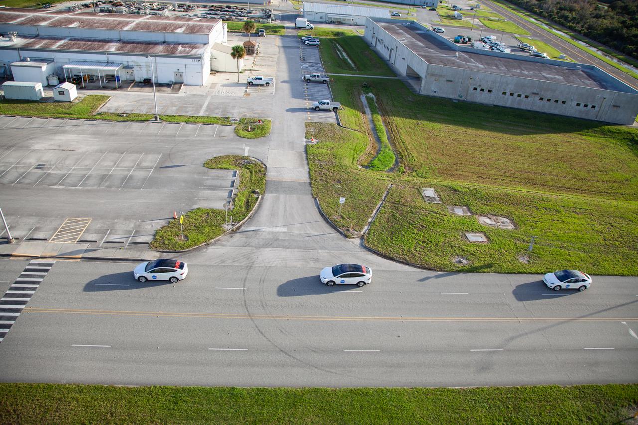 Two Tesla vehicles carrying the NASA SpaceX Crew-1 astronauts are on their way to Launch Complex 39A on Nov. 15, 2020, at NASA’s Kennedy Space Center in Florida. Inside the vehicles are NASA astronaut Michael Hopkins, spacecraft commander; NASA astronaut Victor Glover, pilot; NASA astronaut Shannon Walker, mission specialist; and Japan Aerospace Exploration Agency astronaut Soichi Noguchi, mission specialist. Crew-1 is the first regular crew mission of a U.S. commercial spacecraft with astronauts to the International Space Station as part of NASA’s Commercial Crew Program. The SpaceX Crew Dragon Resilience capsule will launch atop the company’s Falcon 9 rocket from Pad 39A to the space station for a six-month science mission.