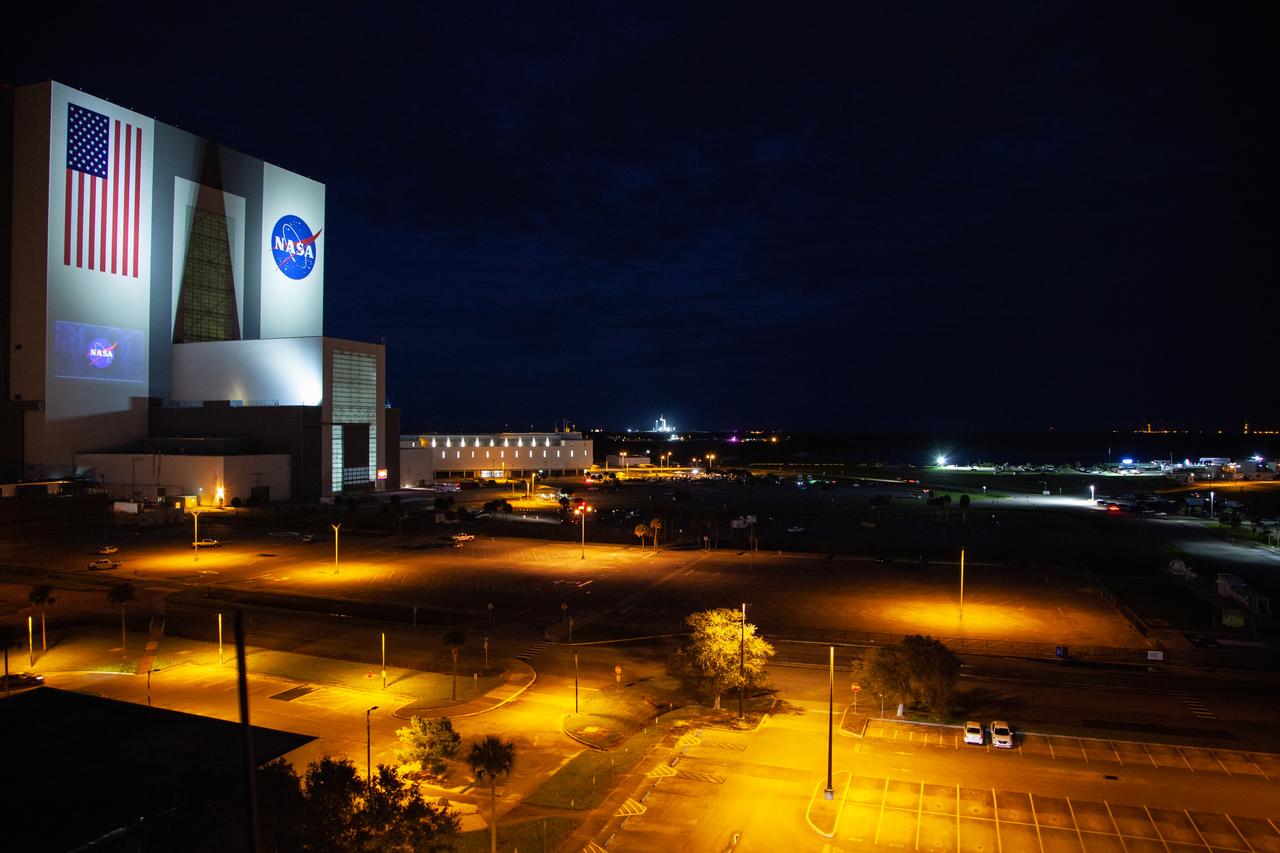With a view of the iconic Vehicle Assembly Building at left, a SpaceX Falcon 9 rocket soars upward from Launch Complex 39A at NASA’s Kennedy Space Center in Florida on Nov. 15, 2020, carrying the company’s Crew Dragon Resilience capsule. Launch time was at 7:27 p.m. EST. Onboard the capsule are NASA’s SpaceX Crew-1 astronauts, Michael Hopkins, spacecraft commander; Victor Glover, pilot; Shannon Walker, mission specialist; and Japan Aerospace Exploration Agency astronaut Soichi Noguchi, mission specialist. Crew-1 is the first regular crew mission of a U.S. commercial spacecraft with astronauts to the International Space Station as part of NASA’s Commercial Crew Program. The Crew Dragon will dock with the space station and the crew will remain on the orbiting laboratory for a six-month science mission.
