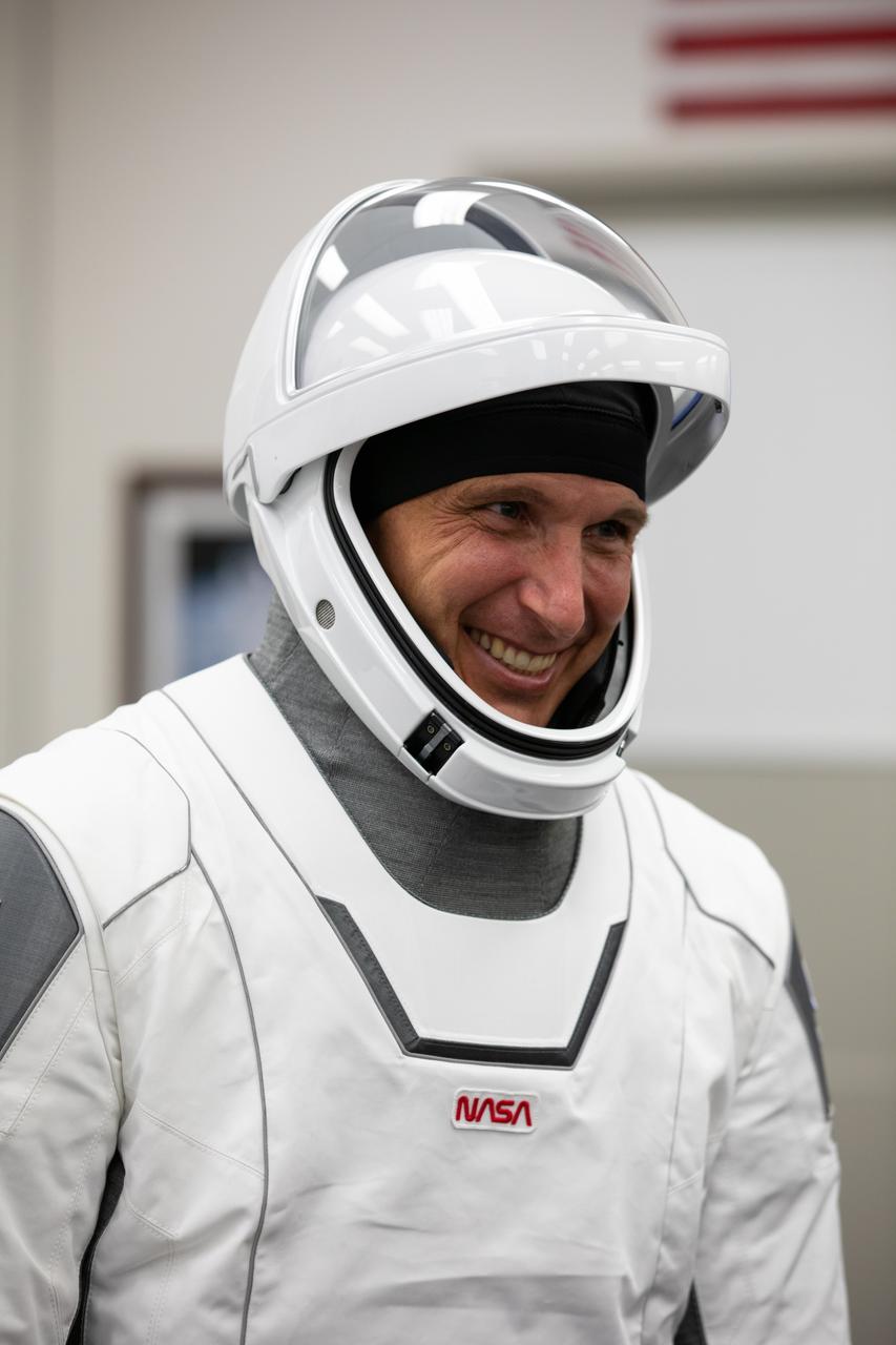 Inside the crew suit-up room in the Neil Armstrong Operations and Checkout Building at NASA’s Kennedy Space Center in Florida, on Nov. 15, 2020, NASA astronaut Michael Hopkins, spacecraft commander, is shown in a SpaceX spacesuit in preparation for NASA SpaceX’s Crew-1 mission. Crew-1 is the first regular crew mission of a U.S. commercial spacecraft with astronauts to the International Space Station as part of NASA’s Commercial Crew Program. The SpaceX Crew Dragon Resilience capsule will launch atop the company’s Falcon 9 rocket from Launch Complex 39A to the space station for a six-month science mission.