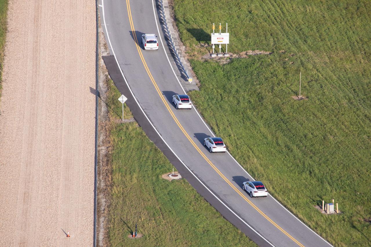 Two Tesla vehicles carrying the NASA SpaceX Crew-1 astronauts are on their way to Launch Complex 39A on Nov. 15, 2020, at NASA’s Kennedy Space Center in Florida. Inside the vehicles are NASA astronaut Michael Hopkins, spacecraft commander; NASA astronaut Victor Glover, pilot; NASA astronaut Shannon Walker, mission specialist; and Japan Aerospace Exploration Agency astronaut Soichi Noguchi, mission specialist. Crew-1 is the first regular crew mission of a U.S. commercial spacecraft with astronauts to the International Space Station as part of NASA’s Commercial Crew Program. The SpaceX Crew Dragon Resilience capsule will launch atop the company’s Falcon 9 rocket from Pad 39A to the space station for a six-month science mission. 