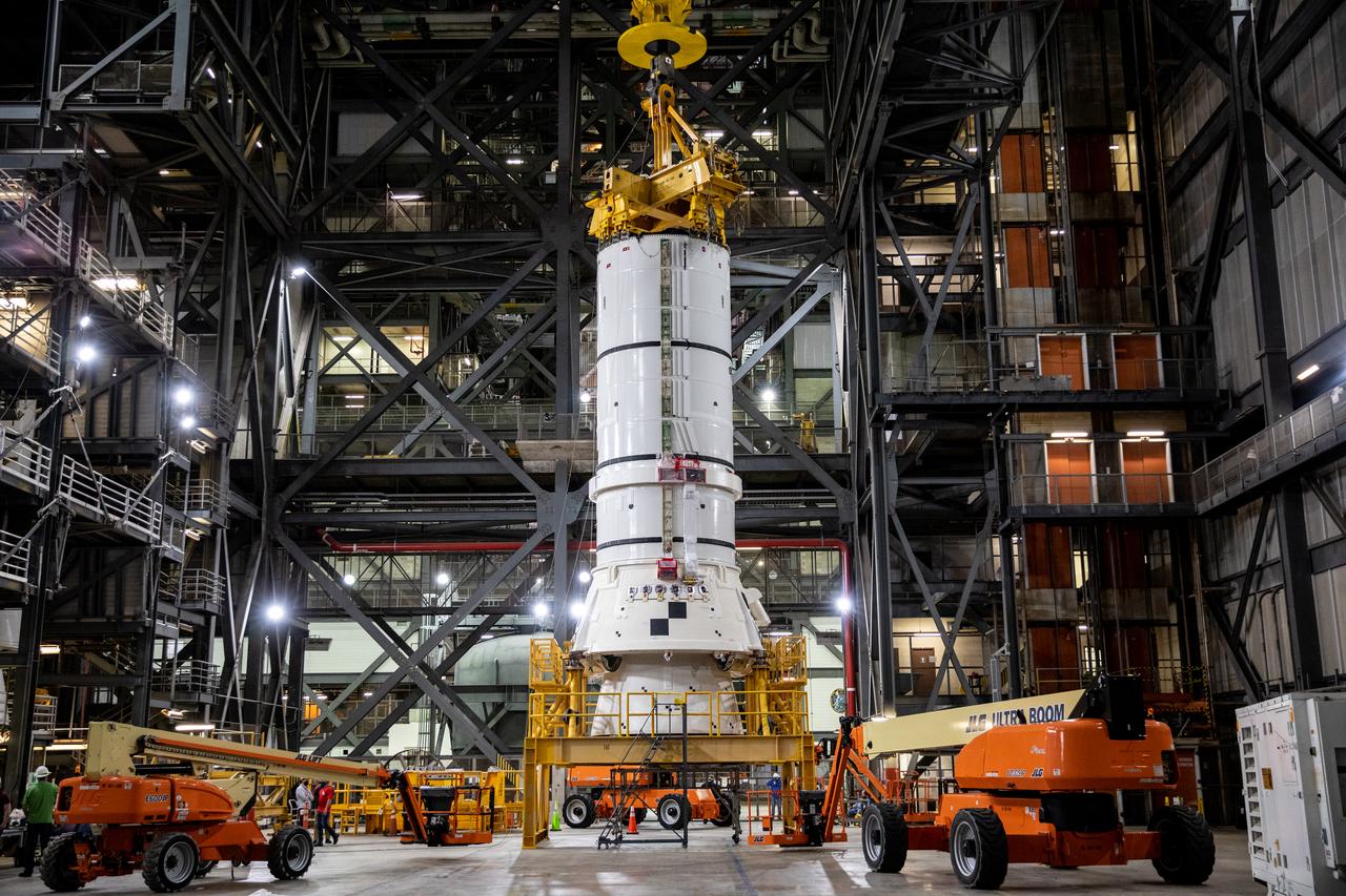 In High Bay 4 of the Vehicle Assembly Building (VAB) at NASA’s Kennedy Space Center in Florida, one of the Artemis I aft booster segments for the Space Launch System is being prepared for stacking operations on Nov. 20, 2020. Workers with Exploration Ground Systems and contractor Jacobs teams will stack the twin five-segment boosters on the mobile launcher in High Bay 3 over a number of weeks. When the core stage arrives, it will join the boosters on the mobile launcher, followed by the interim cryogenic propulsion stage and Orion spacecraft. Manufactured by Northrop Grumman in Utah, the twin boosters provide more than 75 percent of the total SLS thrust at launch. The SLS is managed by Marshall Space Flight Center in Huntsville, Alabama. Under the Artemis program, NASA will land the first woman and the next man on the Moon by 2024. The first in a series of increasingly complex missions, Artemis I will test the Orion spacecraft and SLS as an integrated system ahead of crewed flights to the Moon.