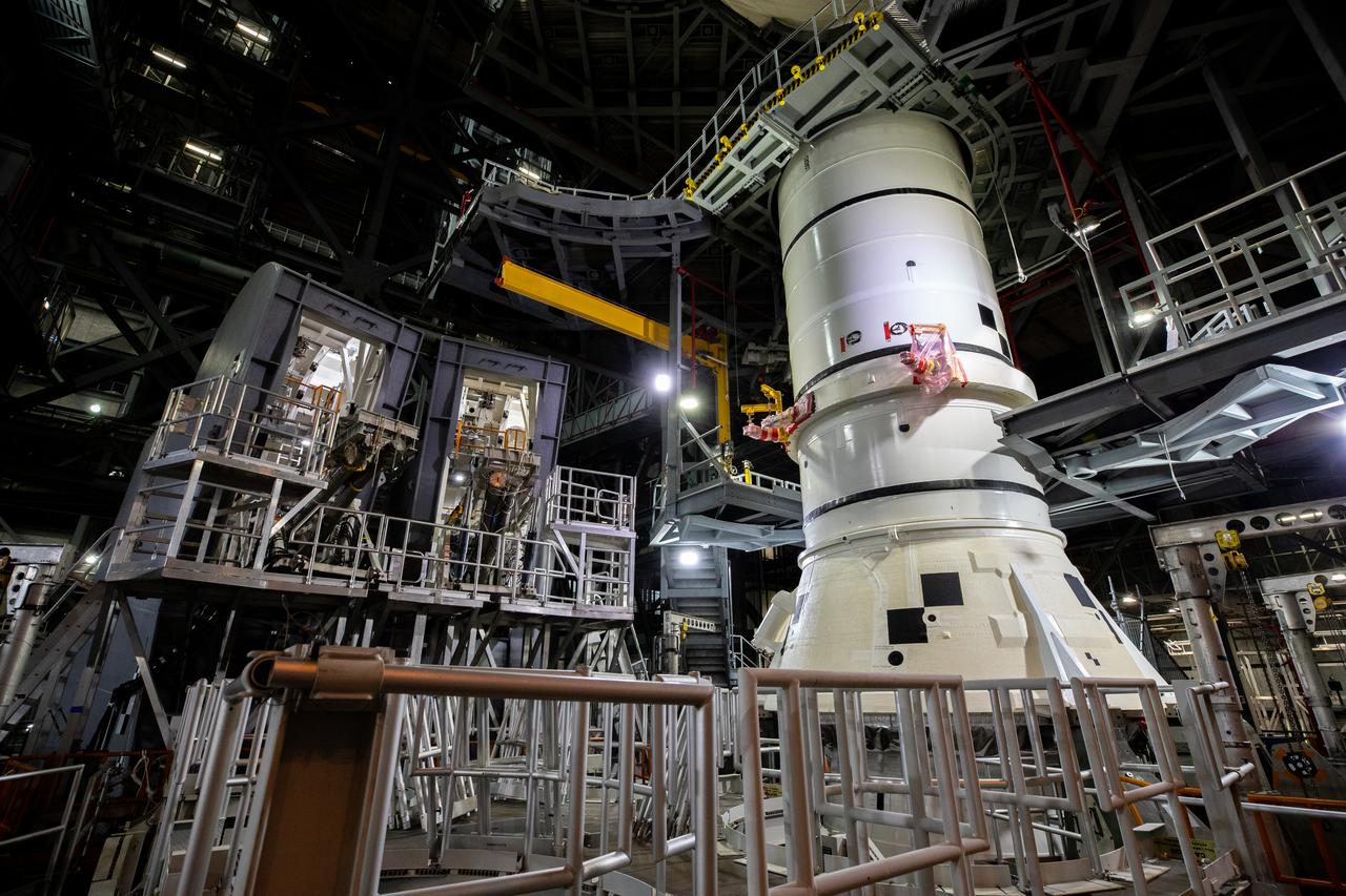 The first of two Artemis I aft booster segments for the Space Launch System is lowered onto the mobile launcher in High Bay 3 of the Vehicle Assembly Building (VAB) at NASA’s Kennedy Space Center in Florida on Nov. 23, 2020. Workers with Exploration Ground Systems and contractor Jacobs teams will stack the twin five-segment boosters on the mobile launcher in High Bay 3 over a number of weeks. When the core stage arrives, it will join the boosters on the mobile launcher, followed by the interim cryogenic propulsion stage and Orion spacecraft. Manufactured by Northrop Grumman in Utah, the twin boosters provide more than 75 percent of the total SLS thrust at launch. The SLS is managed by Marshall Space Flight Center in Huntsville, Alabama. Under the Artemis program, NASA will land the first woman and the next man on the Moon by 2024. The first in a series of increasingly complex missions, Artemis I will test the Orion spacecraft and SLS as an integrated system ahead of crewed flights to the Moon.
