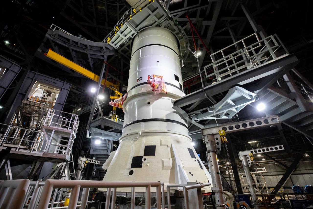 The first of two Artemis I aft booster segments for the Space Launch System is secured onto the mobile launcher in High Bay 3 of the Vehicle Assembly Building (VAB) at NASA’s Kennedy Space Center in Florida on Nov. 23, 2020. Workers with Exploration Ground Systems and contractor Jacobs teams will stack the twin five-segment boosters on the mobile launcher in High Bay 3 over a number of weeks. When the core stage arrives, it will join the boosters on the mobile launcher, followed by the interim cryogenic propulsion stage and Orion spacecraft. Manufactured by Northrop Grumman in Utah, the twin boosters provide more than 75 percent of the total SLS thrust at launch. The SLS is managed by Marshall Space Flight Center in Huntsville, Alabama. Under the Artemis program, NASA will land the first woman and the next man on the Moon by 2024. The first in a series of increasingly complex missions, Artemis I will test the Orion spacecraft and SLS as an integrated system ahead of crewed flights to the Moon.
