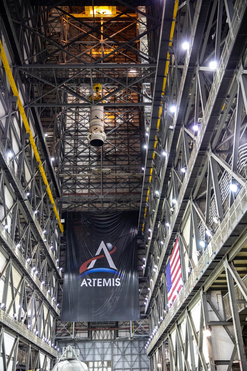 In the Vehicle Assembly Building (VAB) at NASA’s Kennedy Space Center in Florida, the second of two Artemis I aft booster segments for the Space Launch System is lifted high in the transfer aisle for its move into High Bay 3 on Nov. 24, 2020. Workers with Exploration Ground Systems and contractor Jacobs teams will stack the twin five-segment boosters on the mobile launcher in High Bay 3 over a number of weeks. When the core stage arrives, it will join the boosters on the mobile launcher, followed by the interim cryogenic propulsion stage and Orion spacecraft. Manufactured by Northrop Grumman in Utah, the twin boosters provide more than 75 percent of the total SLS thrust at launch. The SLS is managed by Marshall Space Flight Center in Huntsville, Alabama. Under the Artemis program, NASA will land the first woman and the next man on the Moon by 2024. The first in a series of increasingly complex missions, Artemis I will test the Orion spacecraft and SLS as an integrated system ahead of crewed flights to the Moon.