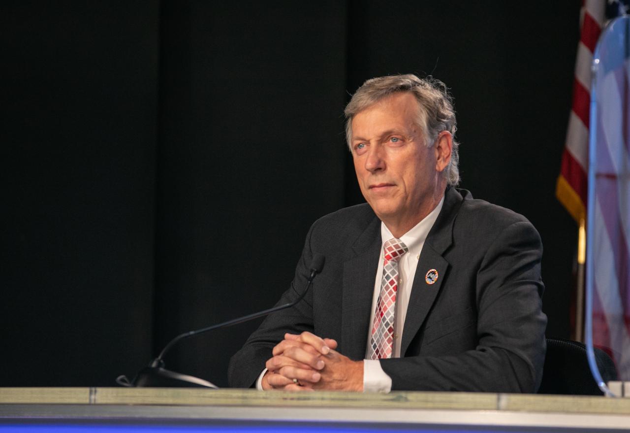 Kenny Todd, deputy program manager, International Space Station Program Office, listens to a question during a CRS-21 prelaunch news conference at NASA’s Kennedy Space Center in Florida on Dec. 4, 2020. Kirt Costello, chief scientist, International Space Station Program Office; Sarah Walker, director, Dragon Mission Management, SpaceX; and Melody Lovin, launch weather officer, U.S. Air Force 45th Space Wing, also participated in the event, which was moderated by NASA Communications’ Jasmine Hopkins. SpaceX’s Falcon 9 rocket, with the upgraded version of the Cargo Dragon spacecraft atop, is targeted to lift off from Kennedy’s Launch Complex 39A Saturday, Dec. 5, at 11:39 a.m. EST. CRS-21 will deliver supplies, equipment, and critical materials needed to support a variety of science and research investigations on the International Space Station.