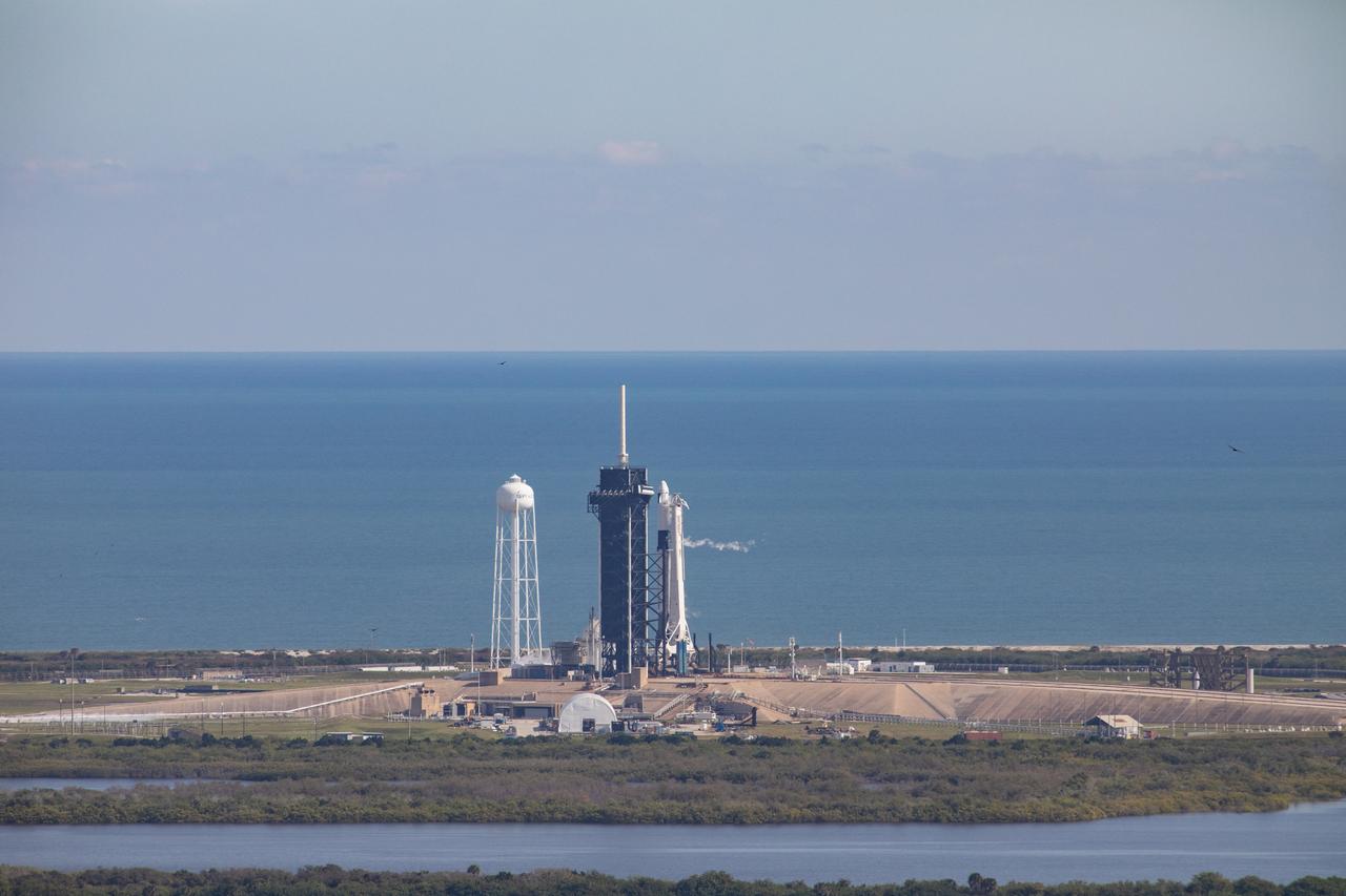 A SpaceX Falcon 9 rocket and cargo Dragon spacecraft stand poised for launch moments before liftoff at Kennedy Space Center’s Launch Complex 39A in Florida on Dec. 6, 2020, for NASA and SpaceX’s 21st Commercial Resupply Services (CRS-21) mission to the International Space Station. The first launch for SpaceX under NASA’s CRS-2 contract, the mission blasted off the pad at 11:17 a.m. EST.
