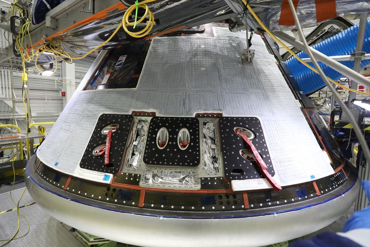 Boeing’s Starliner crew module, with back shells installed, is inside the company’s Commercial Crew and Cargo Processing Facility at Kennedy Space Center on December 8, 2020, in preparation for the Orbital Flight Test-2 (OFT-2). During the OFT-2 mission, the uncrewed Starliner spacecraft will fly to the International Space Station for NASA’s Commercial Crew Program.