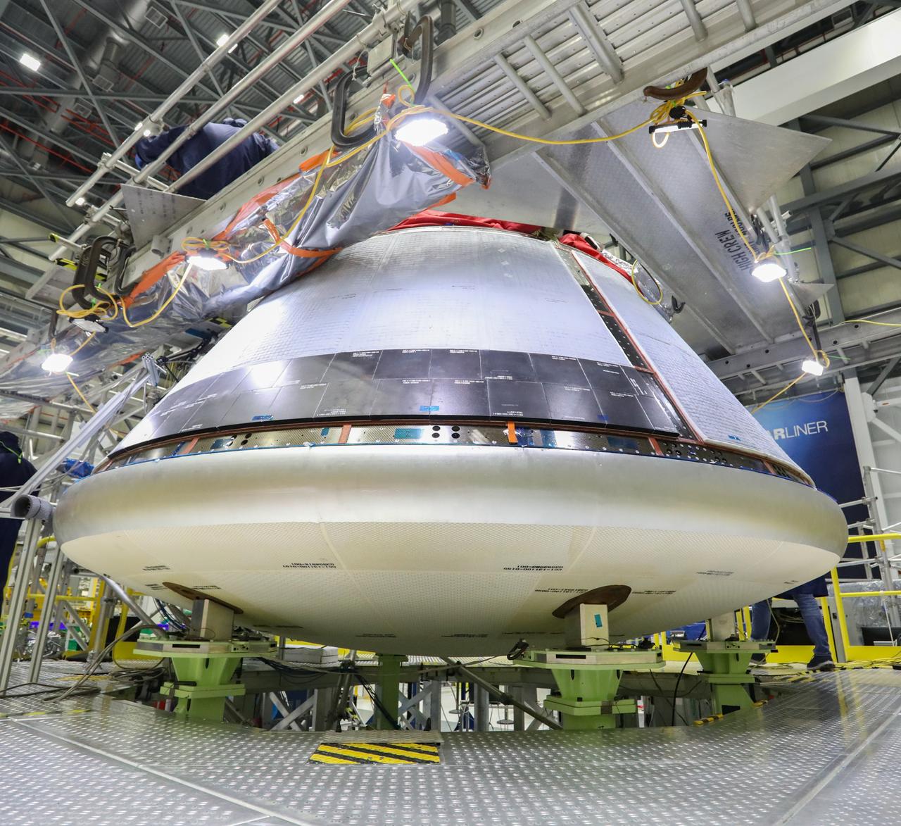 Boeing’s Starliner crew module, with back shells installed, is inside the company’s Commercial Crew and Cargo Processing Facility at Kennedy Space Center on December 8, 2020, in preparation for the Orbital Flight Test-2 (OFT-2). During the OFT-2 mission, the uncrewed Starliner spacecraft will fly to the International Space Station for NASA’s Commercial Crew Program.