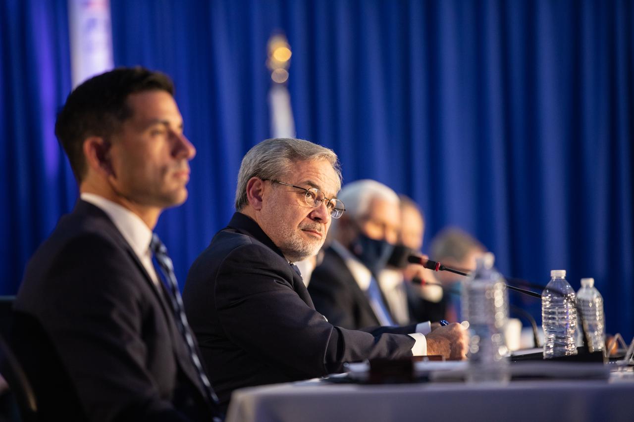 From left, Chad Wolf, acting secretary of Homeland Security, and Dan Brouillette, Secretary of Energy, attend a meeting of the National Space Council inside the Apollo/Saturn V Center at the Kennedy Space Center Visitor Complex in Florida on Dec. 9, 2020. The council's role is to advise the president regarding national space policy and strategy, and to review the nation's long-range goals for space activities. Vice President Mike Pence chaired the meeting, at which he announced the initial team of 18 astronauts eligible for early Artemis missions on and around the Moon. Under the Artemis program, NASA will land the first woman and the next man on the Moon in 2024.