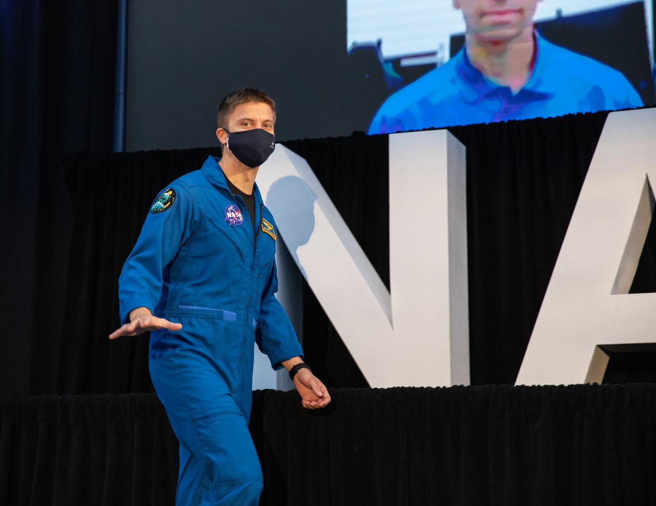 NASA astronaut Matthew Dominick waves during an announcement Dec. 9, 2020, that he is one of the initial team of 18 astronauts eligible for early Artemis missions on and around the Moon. A Colorado native, Dominick was selected as a NASA astronaut in 2017. Joining him at the event were fellow astronauts Joseph Acaba, Jessica Meir, Anne McClain, and Jessica Watkins. Vice President Mike Pence made the announcement at the close of a National Space Council meeting he chaired in the Apollo/Saturn V Center at the Kennedy Space Center Visitor Complex in Florida. Under the Artemis program, NASA will land the first woman and the next man on the Moon in 2024.