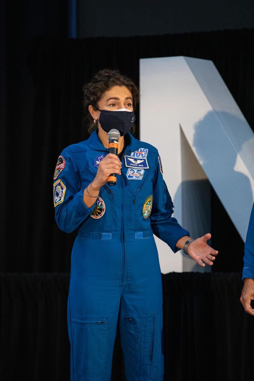 NASA astronaut Jessica Meir speaks to members of the news media during a question-and-answer session Dec. 9, 2020, following a National Space Council meeting inside the Apollo/Saturn V Center at the Kennedy Space Center Visitor Complex in Florida. Vice President Mike Pence chaired the meeting, at which he announced the initial team of 18 astronauts eligible for early Artemis missions on and around the Moon. A Maine native, Meir was selected as a NASA astronaut in 2013 and has spent 205 days in space on one previous flight. She was joined at the event by fellow astronauts Joseph Acaba, Matthew Dominick, Anne McClain, and Jessica Watkins. Under the Artemis program, NASA will land the first woman and the next man on the Moon in 2024.