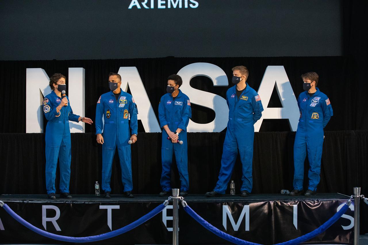 NASA astronaut Jessica Meir speaks to members of the news media during a question-and-answer session Dec. 9, 2020, following a National Space Council meeting inside the Apollo/Saturn V Center at the Kennedy Space Center Visitor Complex in Florida. Vice President Mike Pence chaired the meeting, at which he announced the initial team of 18 astronauts eligible for early Artemis missions on and around the Moon. On stage with Meir, from left, are fellow astronauts Joseph Acaba, Jessica Watkins, Matthew Dominick, and Anne McClain. Under the Artemis program, NASA will land the first woman and the next man on the Moon in 2024.