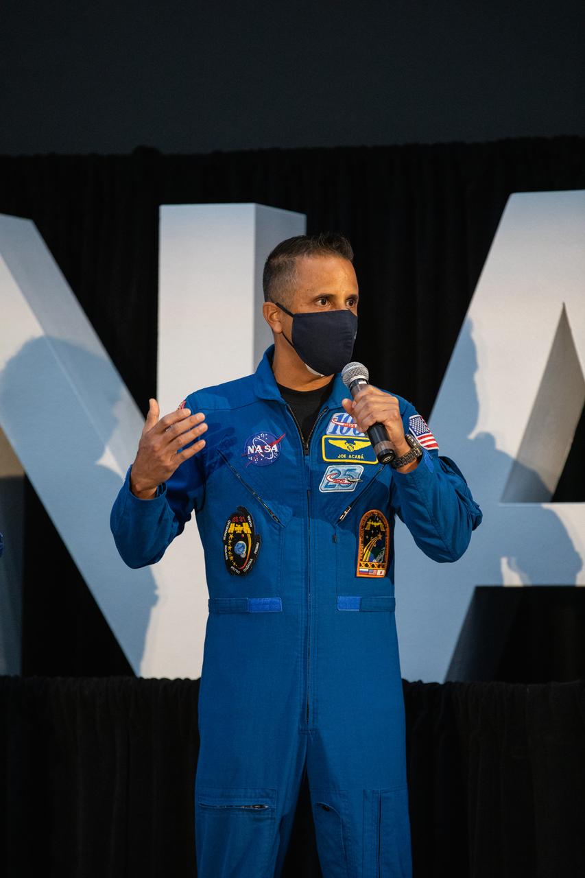 NASA astronaut Joseph Acaba speaks to members of the news media during a question-and-answer session Dec. 9, 2020, following a National Space Council meeting inside the Apollo/Saturn V Center at the Kennedy Space Center Visitor Complex in Florida. Vice President Mike Pence chaired the meeting at which he announced the initial team of 18 astronauts eligible for early Artemis missions on and around the Moon. A California native, Acaba was selected as a NASA astronaut in 2004 and has logged a total of 306 days in space on three flights. He was joined at the event by fellow astronauts Matthew Dominick, Jessica Meir, Anne McClain, and Jessica Watkins. Under the Artemis program, NASA will land the first woman and the next man on the Moon in 2024.