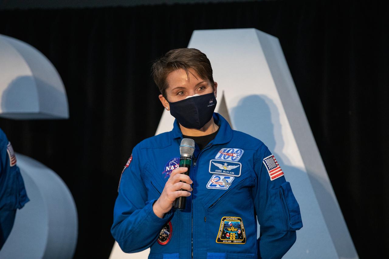 NASA astronaut Anne McClain speaks to members of the news media during a question-and-answer session Dec. 9, 2020, following a National Space Council meeting inside the Apollo/Saturn V Center at the Kennedy Space Center Visitor Complex in Florida. Vice President Mike Pence chaired the meeting, at which he announced the initial team of 18 astronauts eligible for early Artemis missions on and around the Moon. A native of the state of Washington, McClain was selected as a NASA astronaut in 2013 and has spent 204 days in space on one previous flight. She was joined at the event by fellow astronauts Joseph Acaba, Matthew Dominick, Jessica Meir, and Jessica Watkins. Under the Artemis program, NASA will land the first woman and the next man on the Moon in 2024.