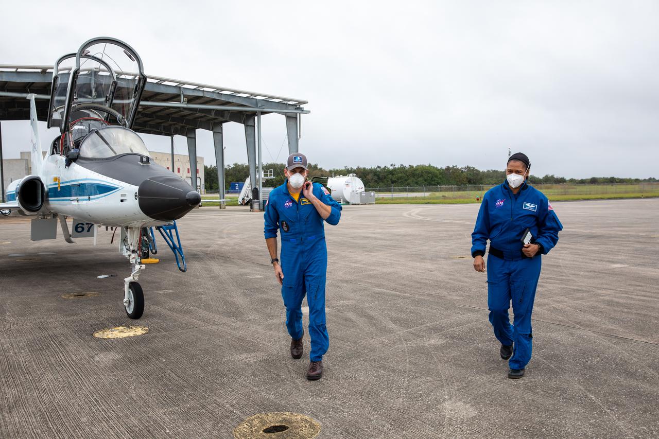 NASA astronauts arrive aboard T-38 jet aircraft at the Launch and Landing Facility at Kennedy Space Center in Florida on Dec. 17, 2020. The astronauts are at Kennedy to prepare for their flights to the International Space Station on Boeing’s CST-100 Starliner, as part of the agency’s Commercial Crew Program. From left are Josh Cassada and Jeanette Epps.