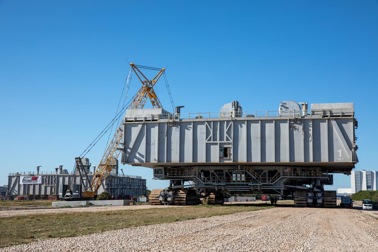 The two mobile launcher platforms (MLPs) are seen at the MSS park site at NASA’s Kennedy Space Center in Florida on Jan. 4, 2021. One MLP is undergoing crawlerway conditioning – a several month-long project to ensure the path the rocket takes from the VAB to the launch pad is strong enough to support the weight for the upcoming Artemis I launch. The other MLP used during the shuttle program is in the process of being demolished.