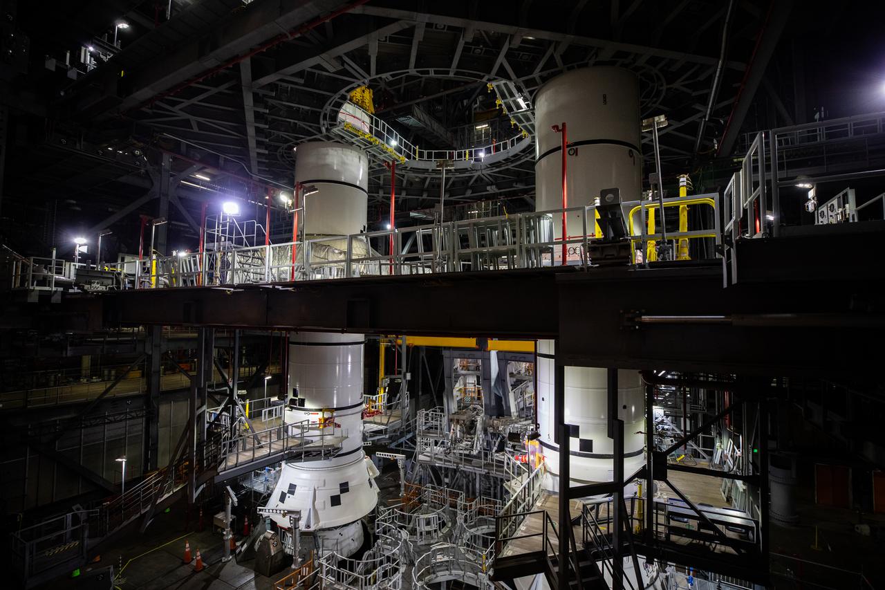 In High Bay 3 of the Vehicle Assembly Building at NASA’s Kennedy Space Center in Florida, the right-hand and left-hand center aft booster segments for Artemis I have been stacked onto the left and right aft booster segments on the mobile launcher for the Space Launch System (SLS) on Jan. 12, 2021. Workers with Exploration Ground Systems and contractor Jacobs teams will stack the twin five-segment boosters on the mobile launcher in High Bay 3 over a number of weeks. When the core stage arrives, it will join the boosters on the mobile launcher, followed by the interim cryogenic propulsion stage and Orion spacecraft. Manufactured by Northrop Grumman in Utah, the twin boosters provide more than 75 percent of the total SLS thrust at launch. The SLS is managed by Marshall Space Flight Center in Huntsville, Alabama. Under the Artemis program, NASA will land the first woman and the next man on the Moon by 2024. The first in a series of increasingly complex missions, Artemis I will test the Orion spacecraft and SLS as an integrated system ahead of crewed flights to the Moon.
