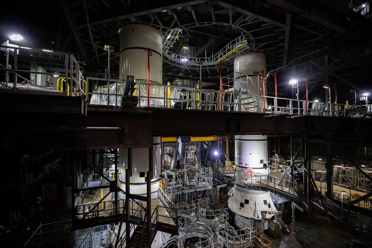 In High Bay 3 of the Vehicle Assembly Building at NASA’s Kennedy Space Center in Florida, the right-hand and left-hand center aft booster segments for Artemis I have been stacked onto the left and right aft booster segments on the mobile launcher for the Space Launch System (SLS) on Jan. 12, 2021. Workers with Exploration Ground Systems and contractor Jacobs teams will stack the twin five-segment boosters on the mobile launcher in High Bay 3 over a number of weeks. When the core stage arrives, it will join the boosters on the mobile launcher, followed by the interim cryogenic propulsion stage and Orion spacecraft. Manufactured by Northrop Grumman in Utah, the twin boosters provide more than 75 percent of the total SLS thrust at launch. The SLS is managed by Marshall Space Flight Center in Huntsville, Alabama. Under the Artemis program, NASA will land the first woman and the next man on the Moon by 2024. The first in a series of increasingly complex missions, Artemis I will test the Orion spacecraft and SLS as an integrated system ahead of crewed flights to the Moon.
