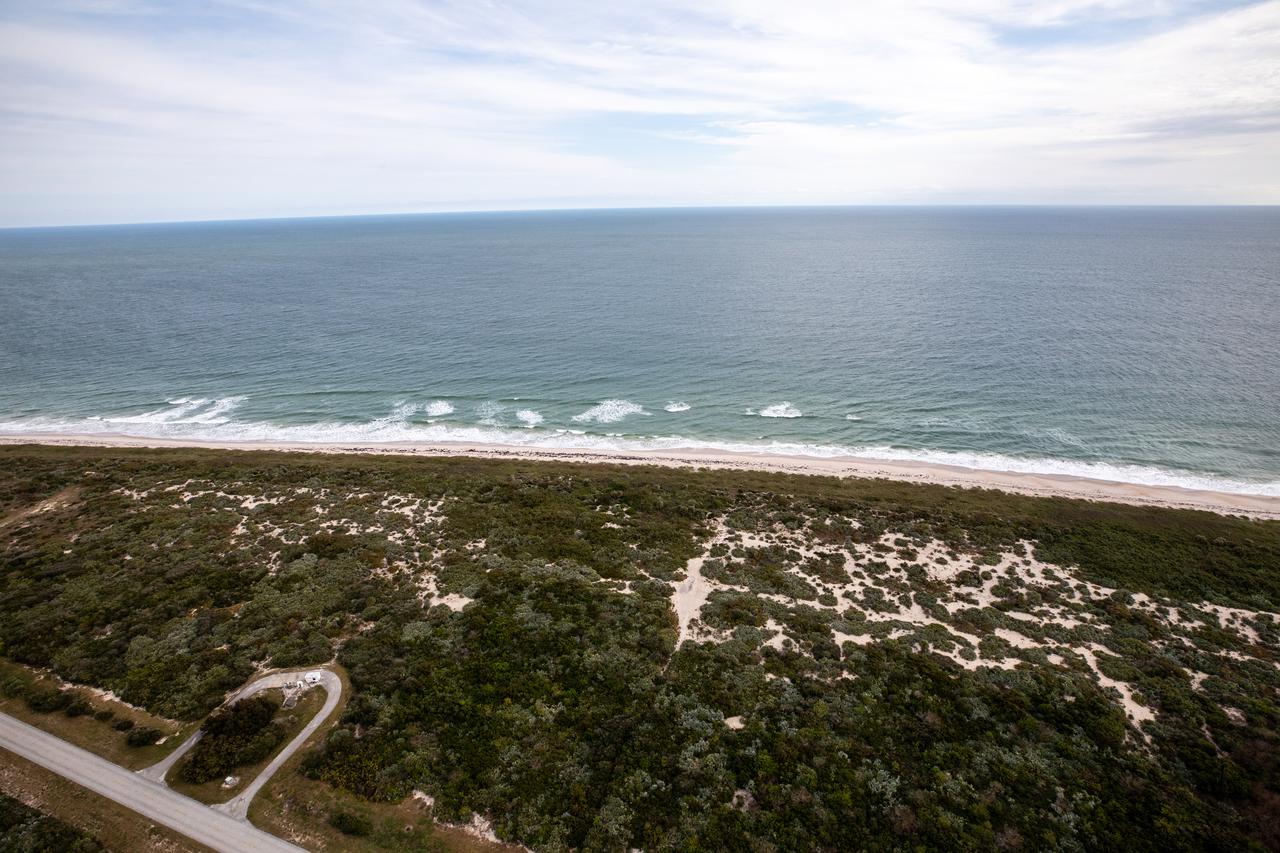 An aerial view of the Atlantic Ocean coastline and dunes along NASA’s Kennedy Space Center in Florida on Jan. 13, 2021.