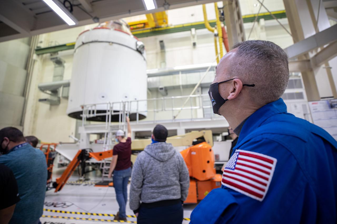 Orion is revealed for one of the final times on Jan. 14, as it is moved by crane to its transport pallet inside the Neil Armstrong Operations and Checkout Building at NASA’s Kennedy Space Center in Florida, along its path to the pad ahead of the Artemis I launch. Teams across the globe have worked tirelessly to assemble the spacecraft which will receive a protective covering prior to departing for the Multi-Payload Processing Facility to begin ground processing by the Exploration Ground Systems and Jacobs teams.