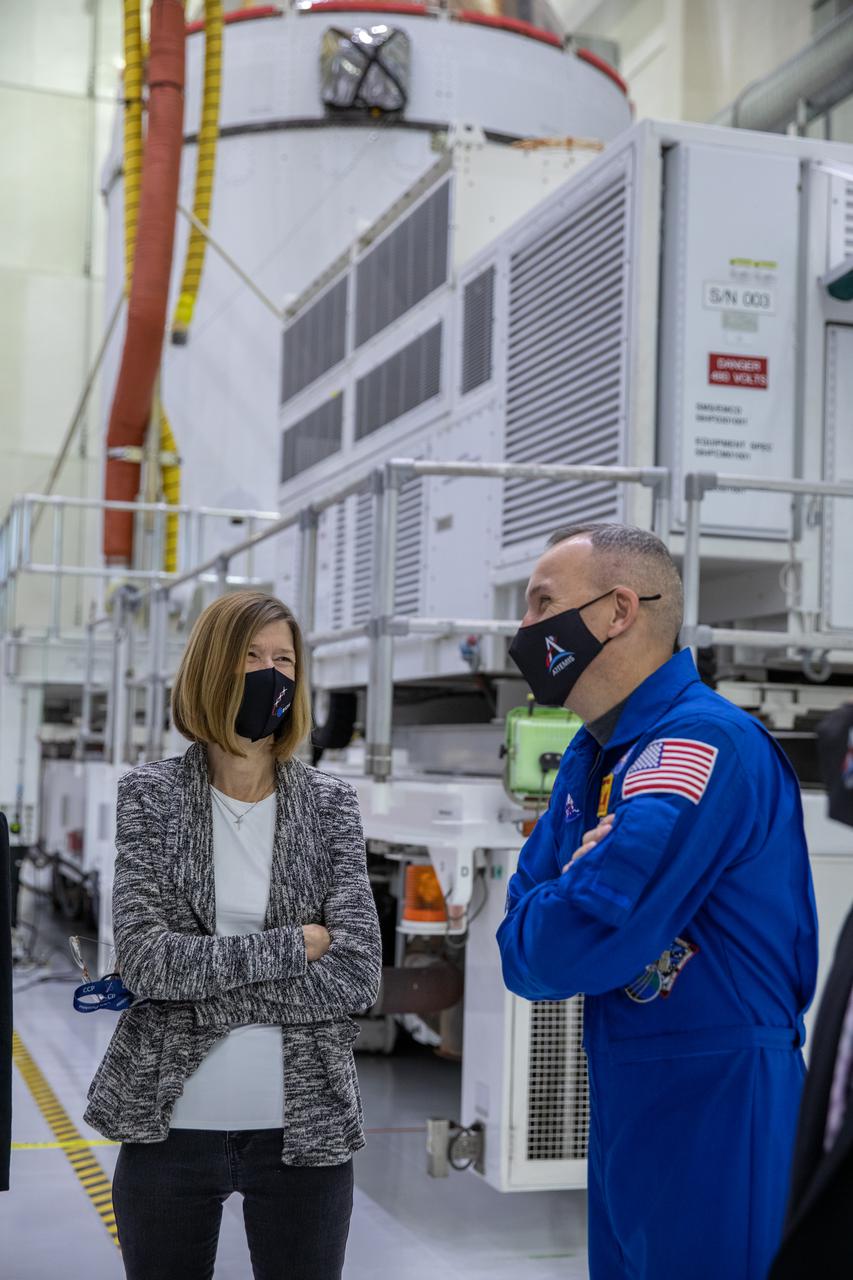 Orion is revealed for one of the final times on Jan. 14, as it is readied atop its transport pallet from the Neil Armstrong Operations and Checkout Building at NASA’s Kennedy Space Center in Florida, along its path to the pad ahead of the Artemis I launch. Touring the high bay, from left, are Kathy Lueders, associate administrator of the Human Exploration and Operations Mission Directorate, and NASA astronaut Randy Bresnik. Teams across the globe have worked tirelessly to assemble the spacecraft, which will receive a protective covering prior to departing for the Multi-Payload Processing Facility to begin ground processing by the Exploration Ground Systems and Jacobs teams.