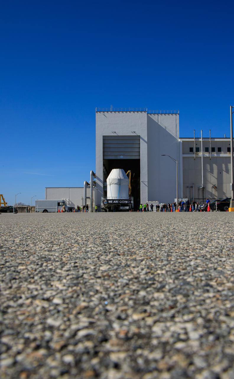 Orion sits atop a transport vehicle as it departs from its home at the Neil Armstrong Operations and Checkout Building at NASA’s Kennedy Space Center in Florida on Jan.16, 2021. Orion’s next stop will be the Multi-Payload Processing Facility where it will undergo ground processing with the Exploration Ground Systems team taking over ground processing ahead of the Artemis I launch.