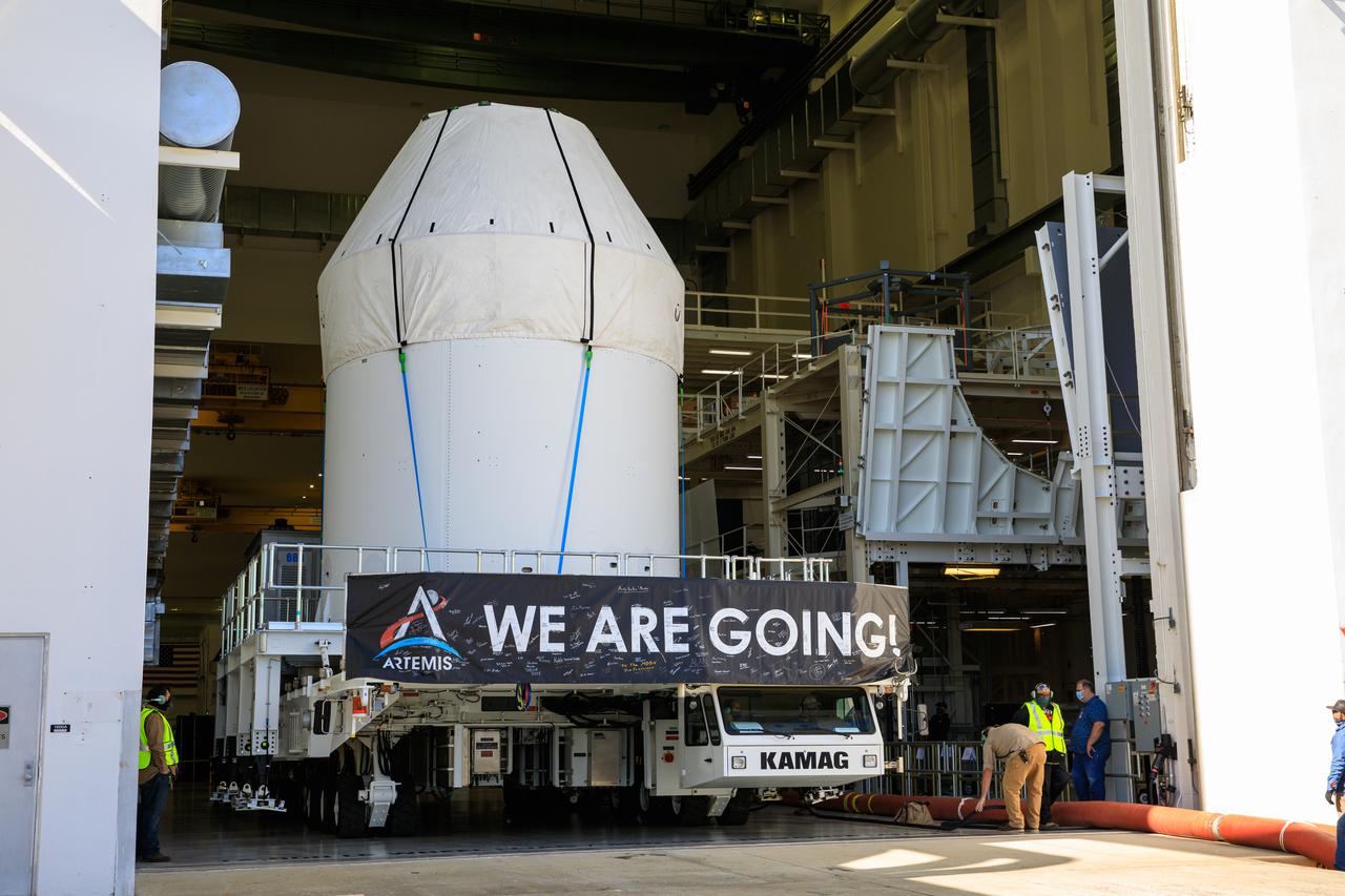 Orion is buttoned up as it sits atop a transport vehicle ready to depart from its home at the Neil Armstrong Operations and Checkout Building at NASA’s Kennedy Space Center in Florida on Jan.16, 2021. Orion will begin its trek to the Multi-Payload Processing Facility. There it will undergo ground processing with the Exploration Ground Systems team taking over ground processing ahead of the Artemis I launch.