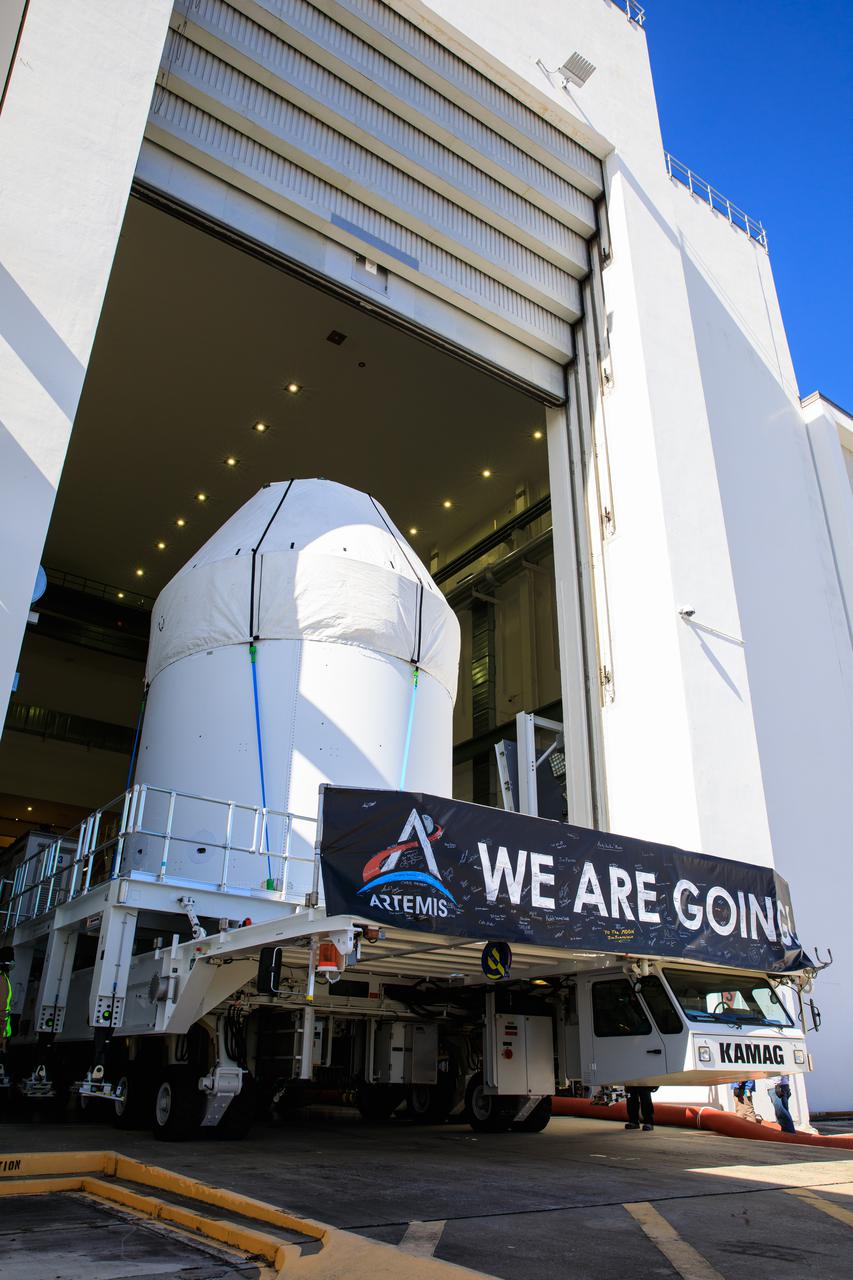 Orion is buttoned up as it sits atop a transport vehicle ready to depart from its home at the Neil Armstrong Operations and Checkout Building at NASA’s Kennedy Space Center in Florida on Jan.16, 2021. Orion will begin its trek to the Multi-Payload Processing Facility. There it will undergo ground processing with the Exploration Ground Systems team taking over ground processing ahead of the Artemis I launch.