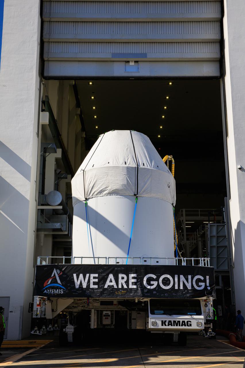 Orion is buttoned up as it sits atop a transport vehicle ready to depart from its home at the Neil Armstrong Operations and Checkout Building at NASA’s Kennedy Space Center in Florida on Jan.16, 2021. Orion will begin its trek to the Multi-Payload Processing Facility. There it will undergo ground processing with the Exploration Ground Systems team taking over ground processing ahead of the Artemis I launch.