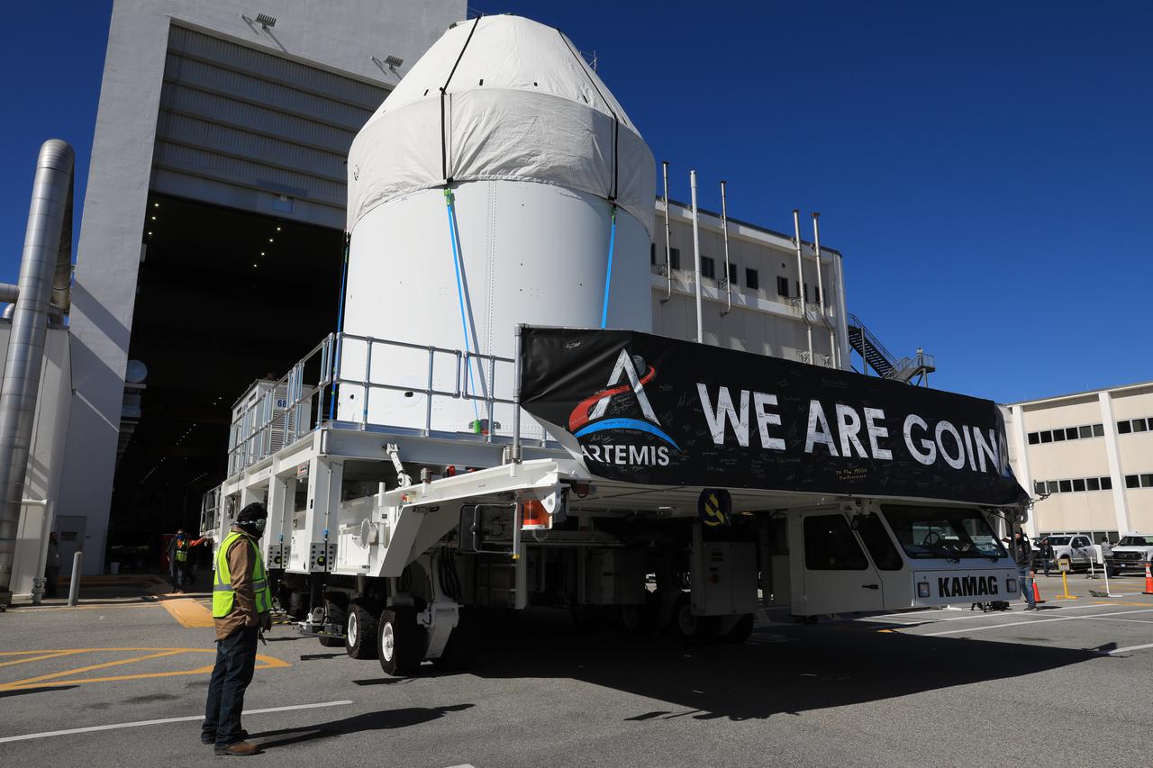 Orion is buttoned up and ready to march towards the Multi-Payload Processing Facility to begin ground processing by the Exploration Ground Systems and Jacobs teams ahead of the Artemis I launch. Shielded by a protective covering for transport, the spacecraft  departs its home at the Neil Armstrong Operations and Checkout Building at NASA's Kennedy Space Center in Florida on Jan. 16, 2021.