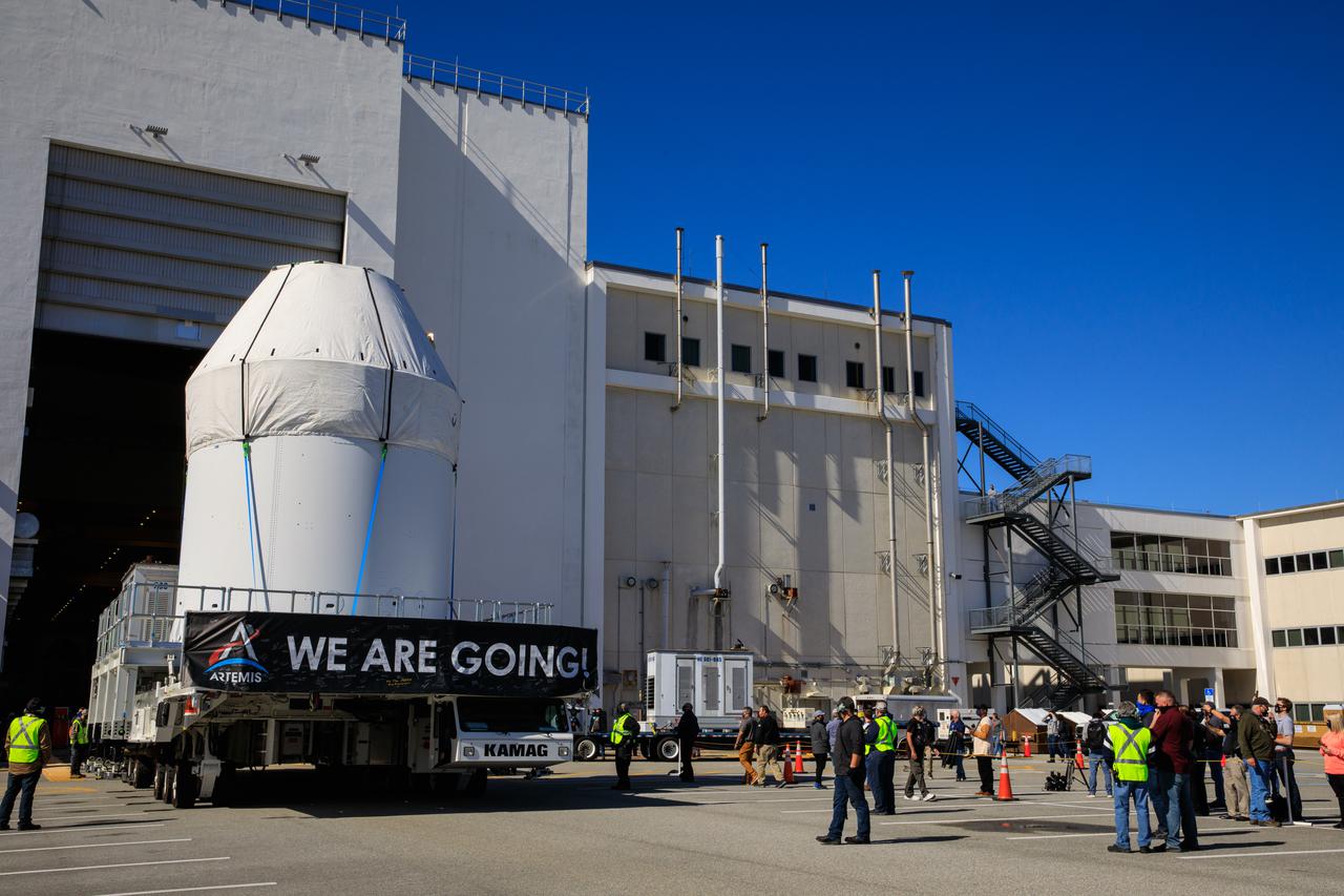 Orion sits atop a transport vehicle as it departs from its home at the Neil Armstrong Operations and Checkout Building at NASA’s Kennedy Space Center in Florida on Jan.16, 2021. Orion will begin its trek to the Multi-Payload Processing Facility. There it will undergo ground processing with the Exploration Ground Systems team taking over ground processing ahead of the Artemis I launch.