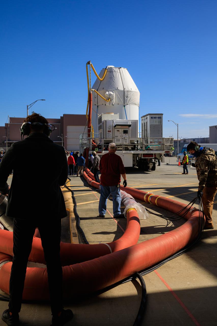 Orion sits atop a transport vehicle as it departs from its home at the Neil Armstrong Operations and Checkout Building at NASA’s Kennedy Space Center in Florida on Jan.16, 2021. Orion will begin its trek to the Multi-Payload Processing Facility. There it will undergo ground processing with the Exploration Ground Systems team taking over ground processing ahead of the Artemis I launch.