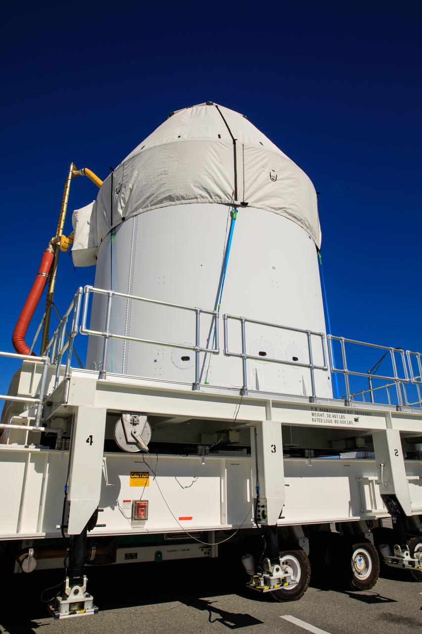 Orion sits atop a transport vehicle as it departs from its home at the Neil Armstrong Operations and Checkout Building at NASA’s Kennedy Space Center in Florida on Jan.16, 2021. Orion will begin its trek to the Multi-Payload Processing Facility. There it will undergo ground processing with the Exploration Ground Systems team taking over ground processing ahead of the Artemis I launch.