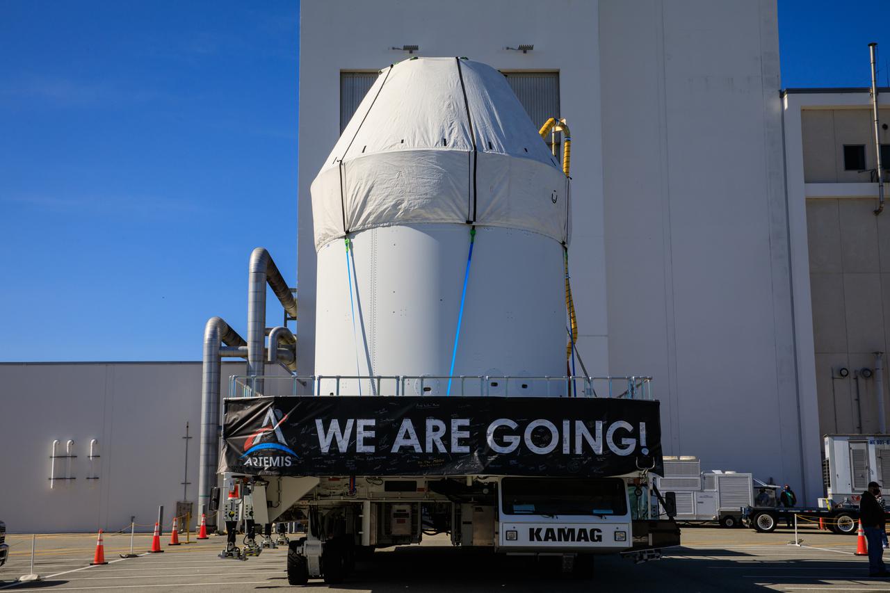 Orion sits atop a transport vehicle as it departs from its home at the Neil Armstrong Operations and Checkout Building at NASA’s Kennedy Space Center in Florida on Jan.16, 2021. Orion will begin its trek to the Multi-Payload Processing Facility. There it will undergo ground processing with the Exploration Ground Systems team taking over ground processing ahead of the Artemis I launch.