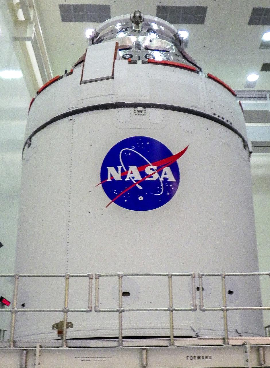 A close-up view of the Artemis I Orion spacecraft with NASA’s famous “meatball” insignia is affixed to the spacecraft adapter jettison fairings, which protect the European built service module, inside the Multi-Payload Processing Facility at Kennedy Space Center on Jan. 20, 2021. Ground processing will begin on Orion, with the Exploration Ground Systems and Jacobs teams performing checkouts and fueling the spacecraft with commodities as part of preparations ahead of the Artemis I mission.