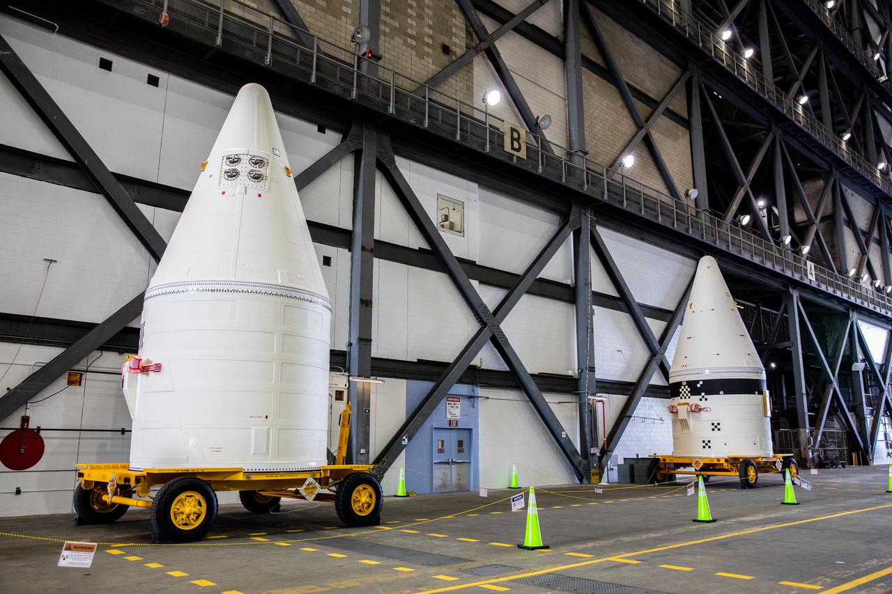 The right-hand and left-hand forward assembly exit cones for the Artemis I Space Launch System (SLS) are in the transfer aisle of the Vehicle Assembly Building at NASA’s Kennedy Space Center in Florida on Jan. 21, 2021. The exit cones will be transferred to High Bay 3 for stacking on the twin boosters on the mobile launcher. Workers with Exploration Ground Systems and contractor Jacobs teams will stack the twin five-segment boosters on the mobile launcher in High Bay 3 over a number of weeks. When the core stage arrives, it will join the boosters on the mobile launcher, followed by the interim cryogenic propulsion stage and Orion spacecraft. Manufactured by Northrop Grumman in Utah, the twin boosters provide more than 75 percent of the total SLS thrust at launch. The SLS is managed by Marshall Space Flight Center in Huntsville, Alabama. Under the Artemis program, NASA will land the first woman and the next man on the Moon by 2024. The first in a series of increasingly complex missions, Artemis I will test the Orion spacecraft and SLS as an integrated system ahead of crewed flights to the Moon.
