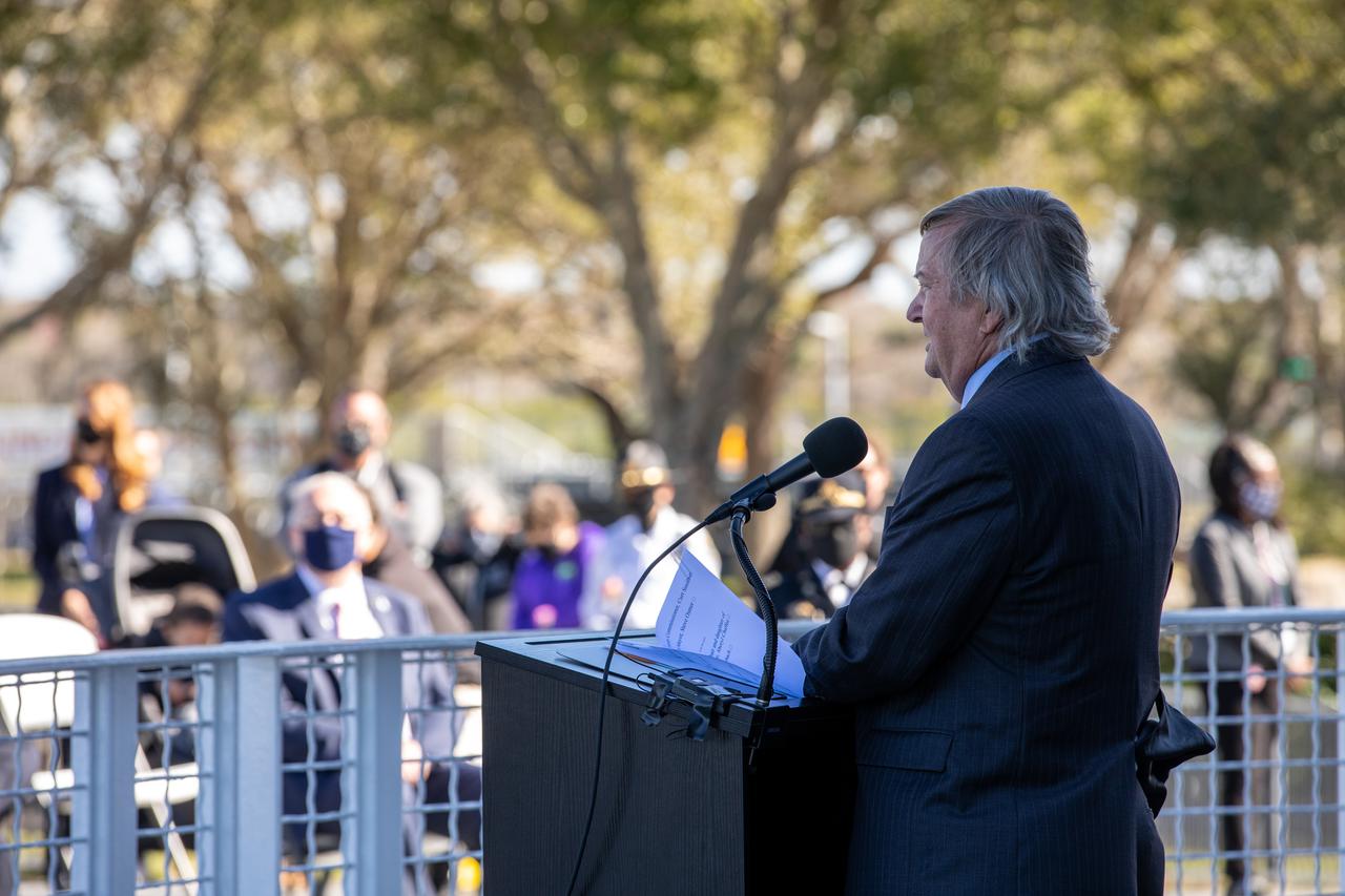 Retired Space Shuttle Launch Director Mike Leinbach speaks during NASA’s Day of Remembrance ceremony on Thursday, Jan. 28, 2021, at the Kennedy Space Center Visitor Complex’s Space Mirror Memorial. The crews of Apollo 1 and space shuttles Challenger and Columbia, as well as other fallen astronauts who lost their lives in the name of space exploration and discovery, were honored by Kennedy employees and guests at the annual memorial event.